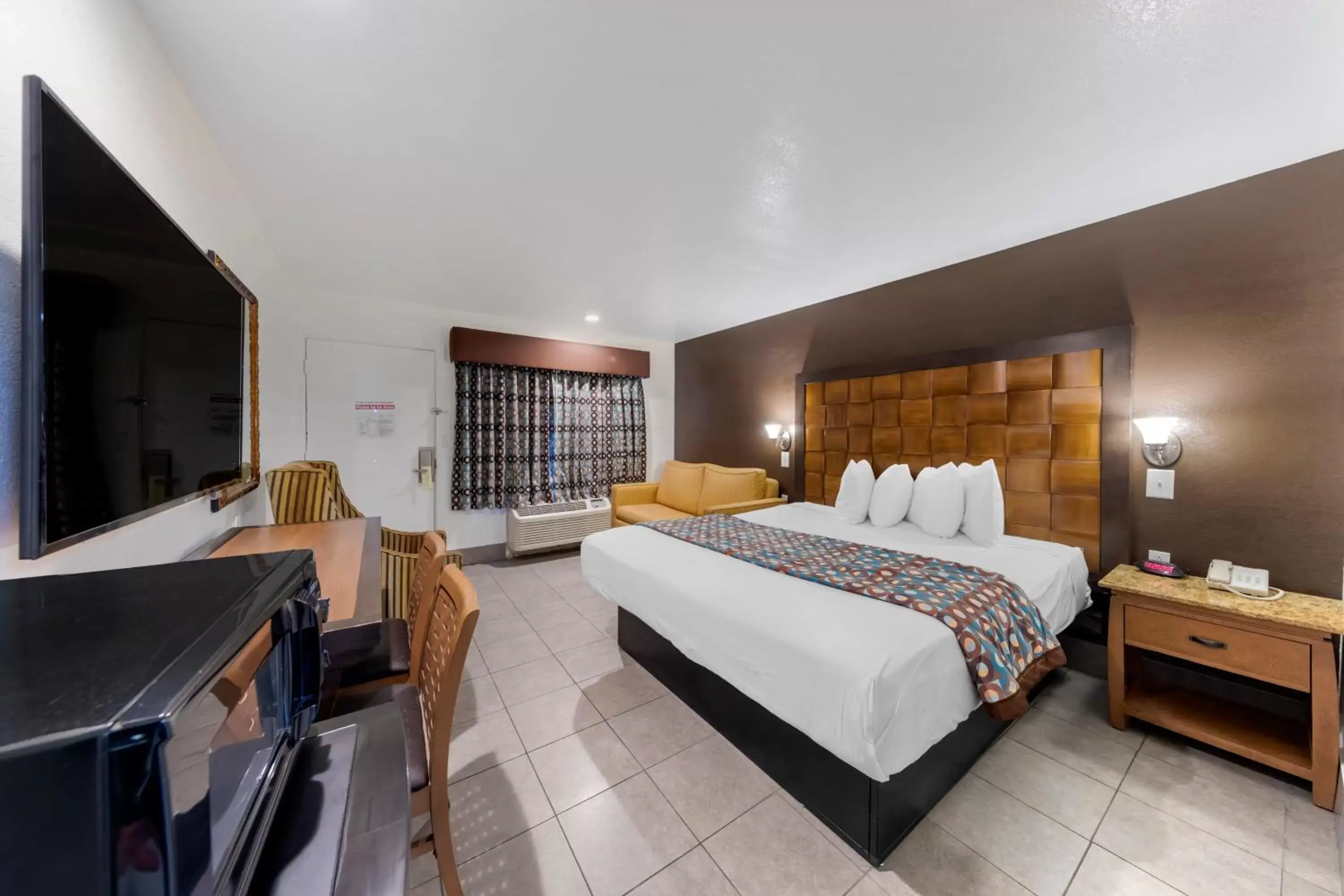 Photo of the whole room, Bed in Anaheim Discovery Inn and Suites Photo of the whole room, Bed in Anaheim Discovery Inn and Suites