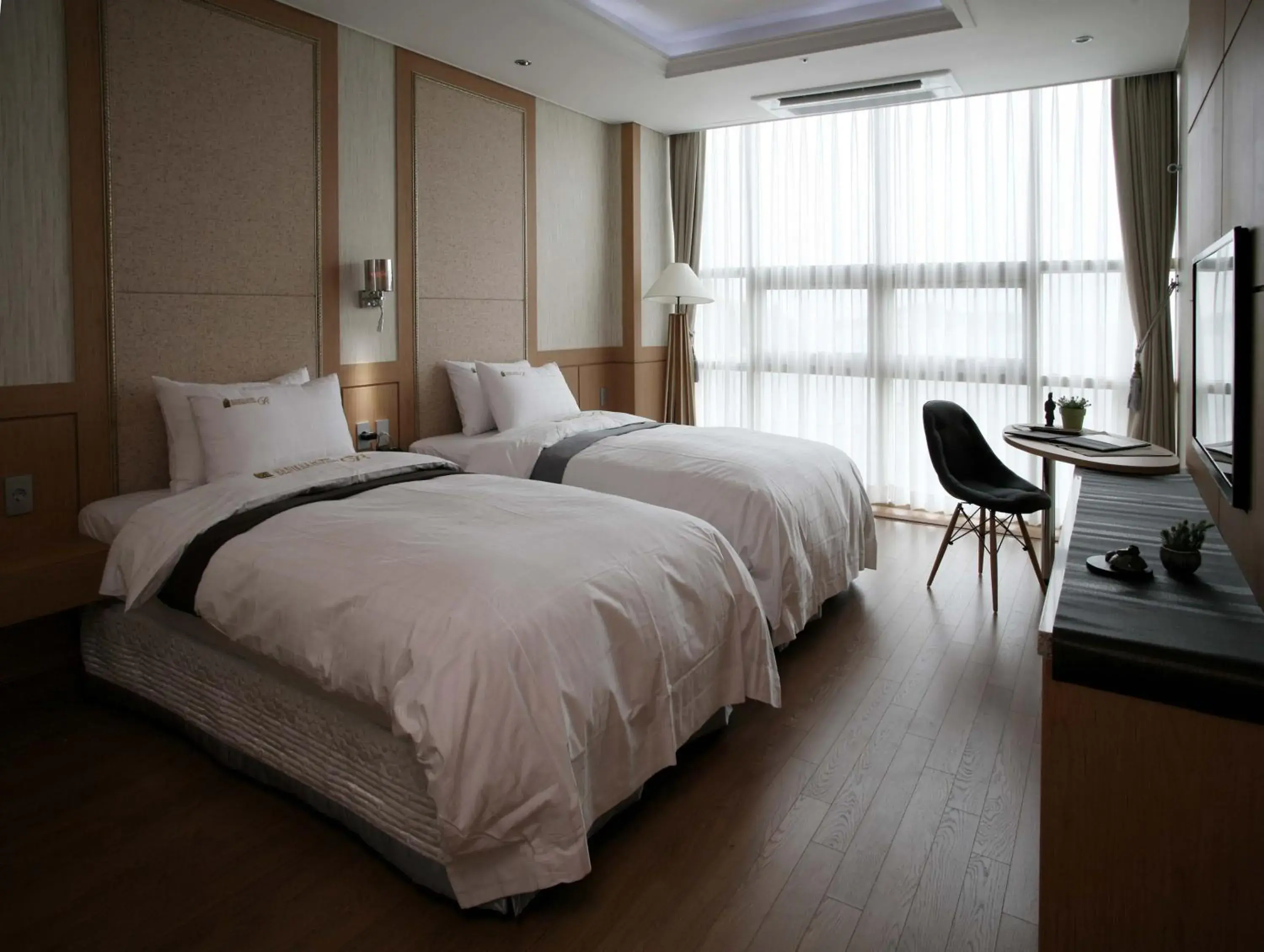 Bed in Benikea Hotel Yeosu