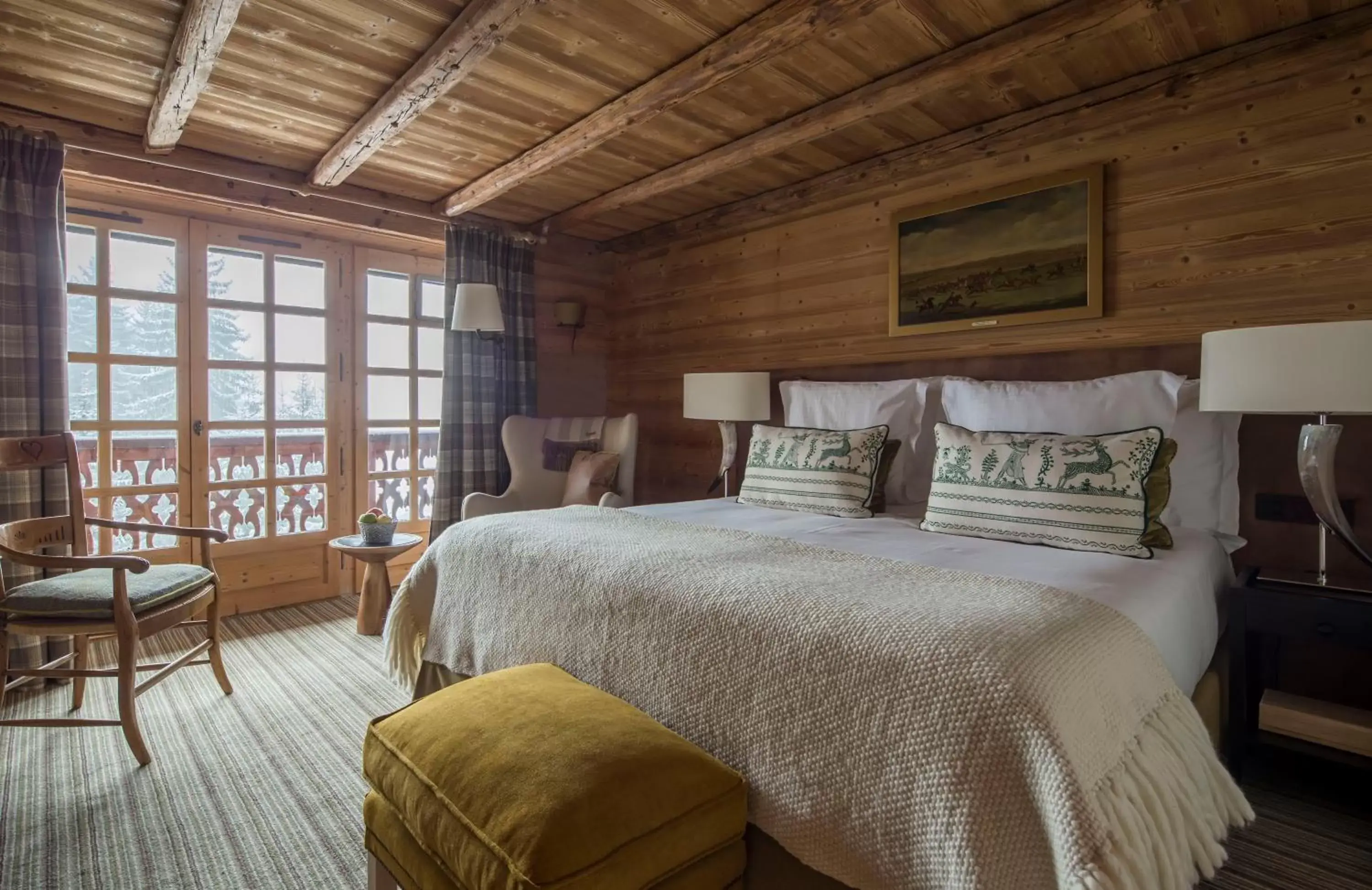 Bed in Les Chalets du Mont d'Arbois Megeve, a Four Seasons Hotel