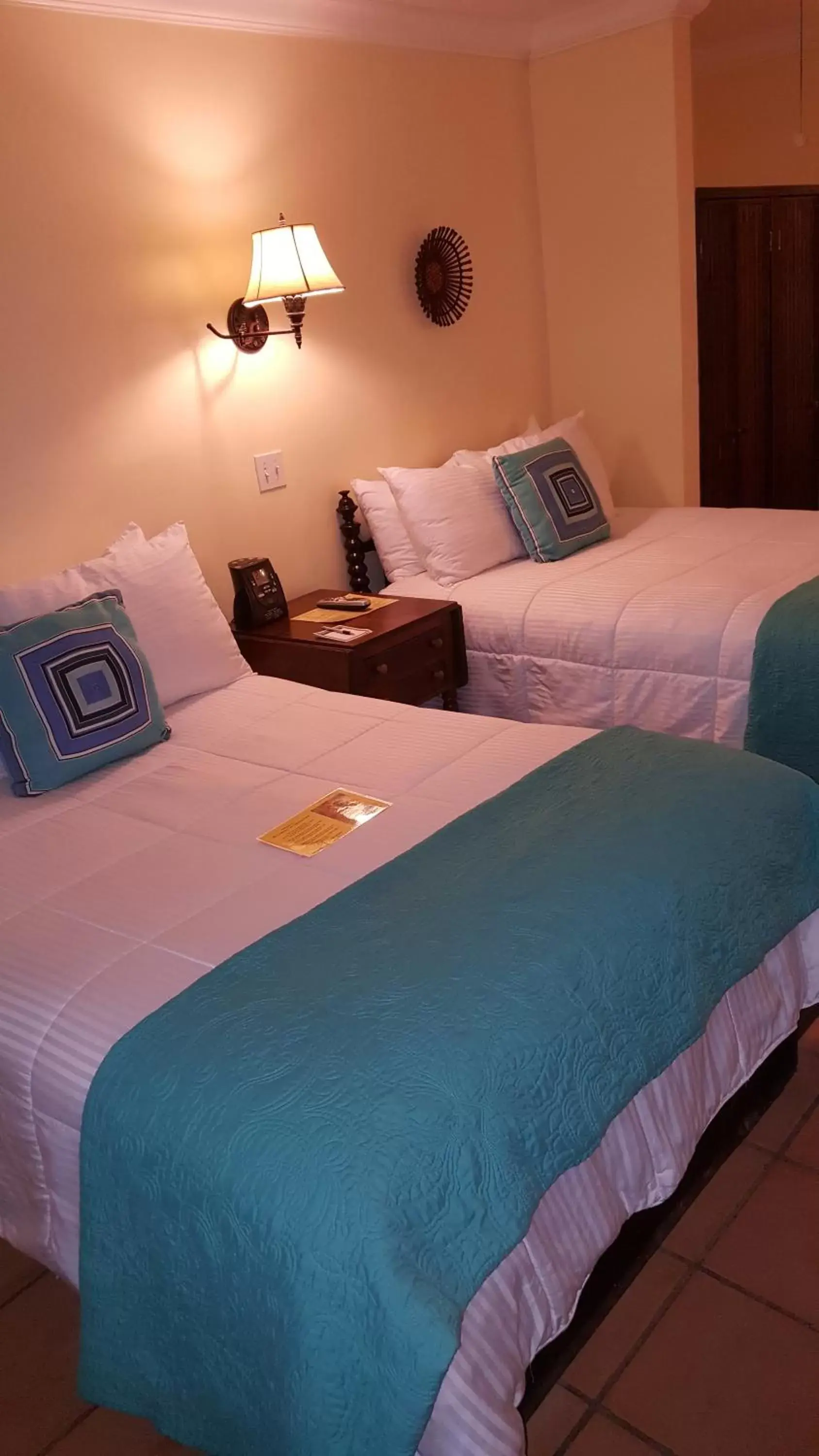 Photo of the whole room, Bed in The Caribbean Court Boutique Hotel