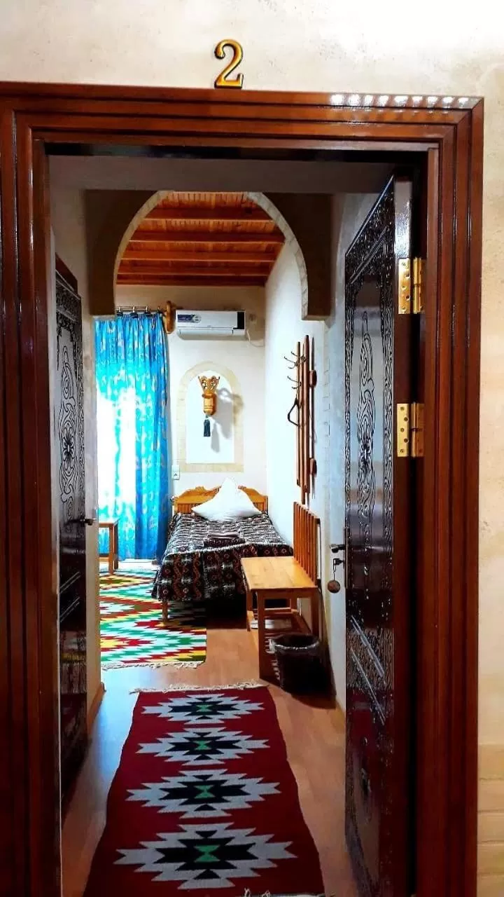 Bed in Zukhro Boutique Hotel