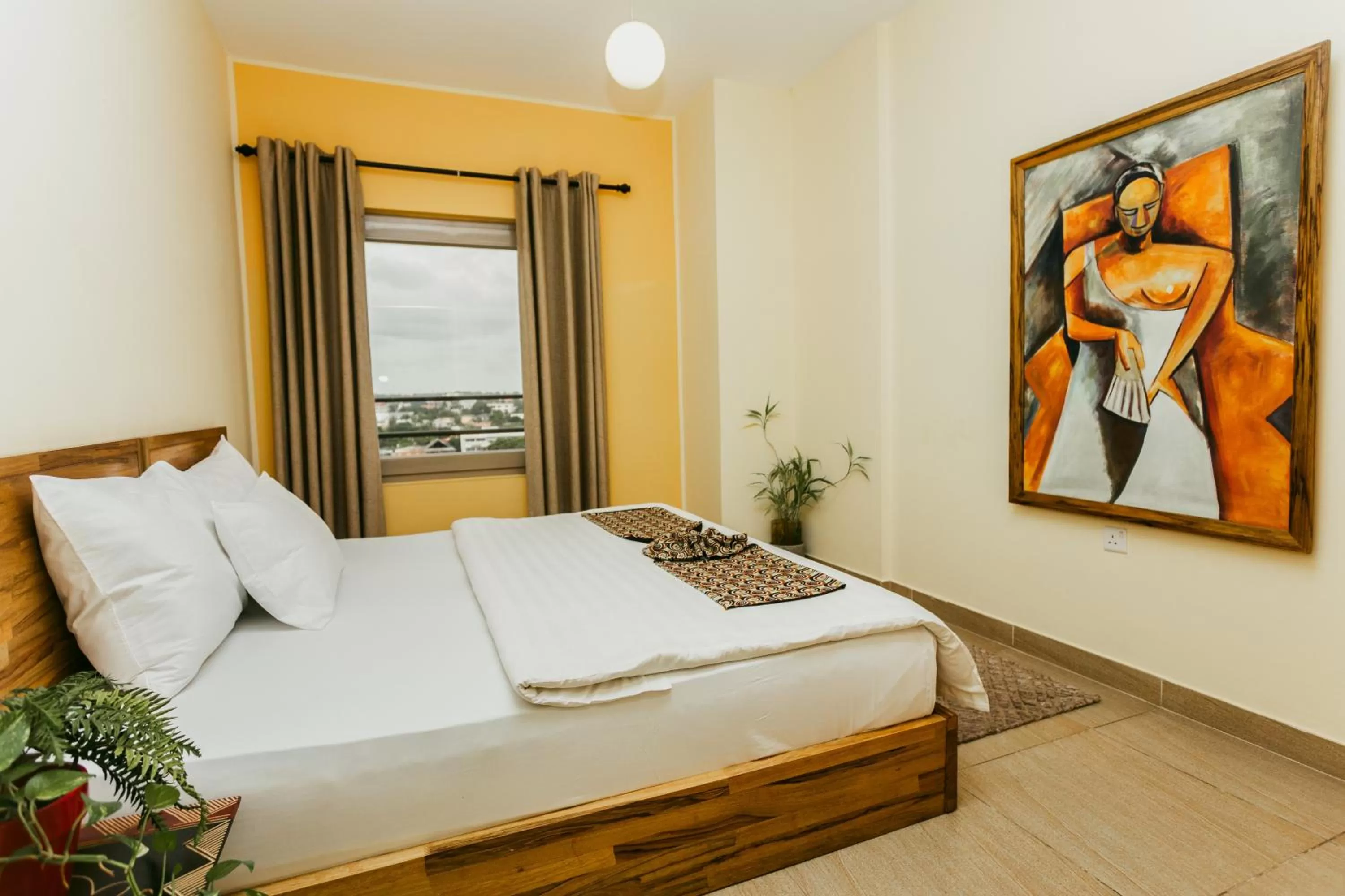 Bed in Roots Hotel Apartment