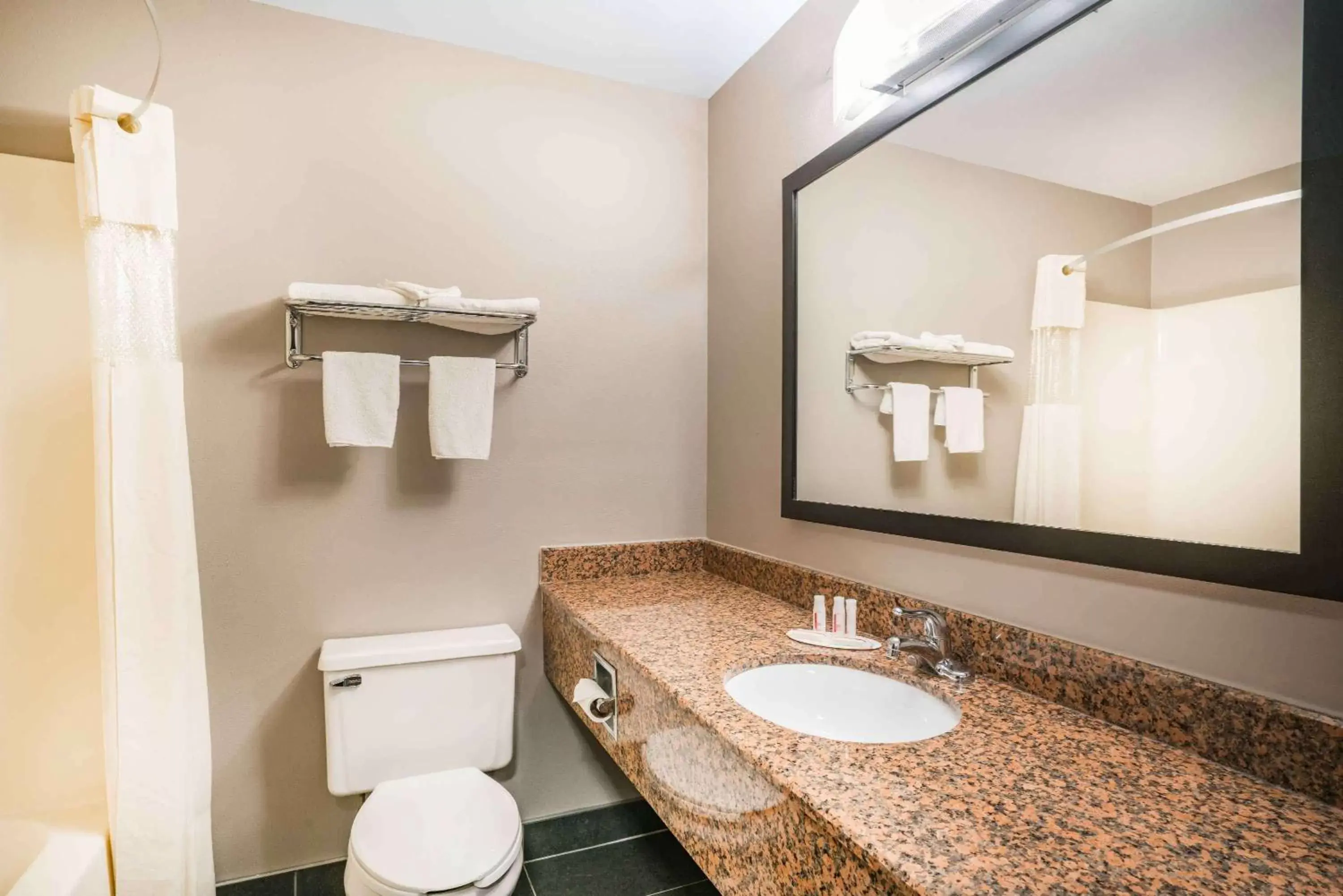 Bathroom in Days Inn & Suites by Wyndham Wausau