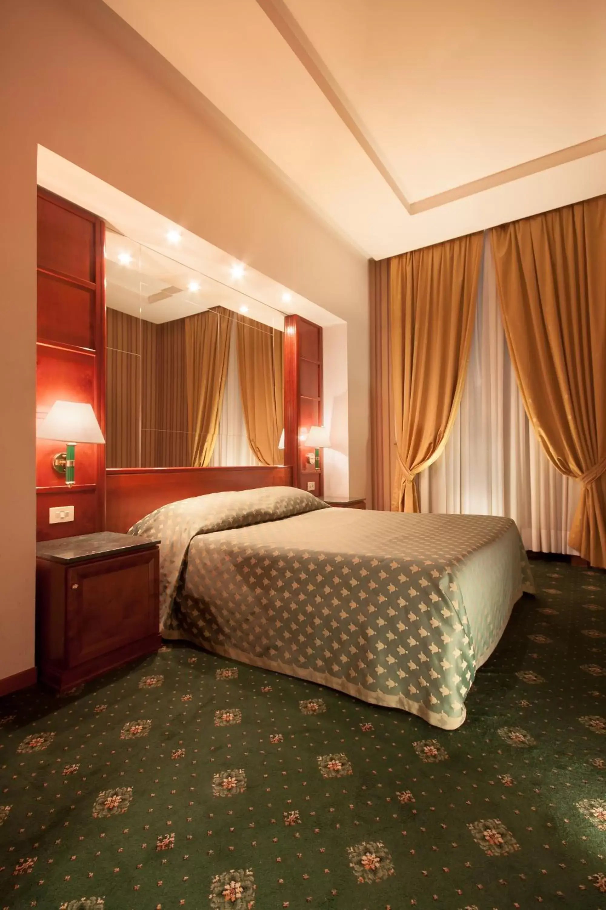 Bed in Atlante Garden Hotel