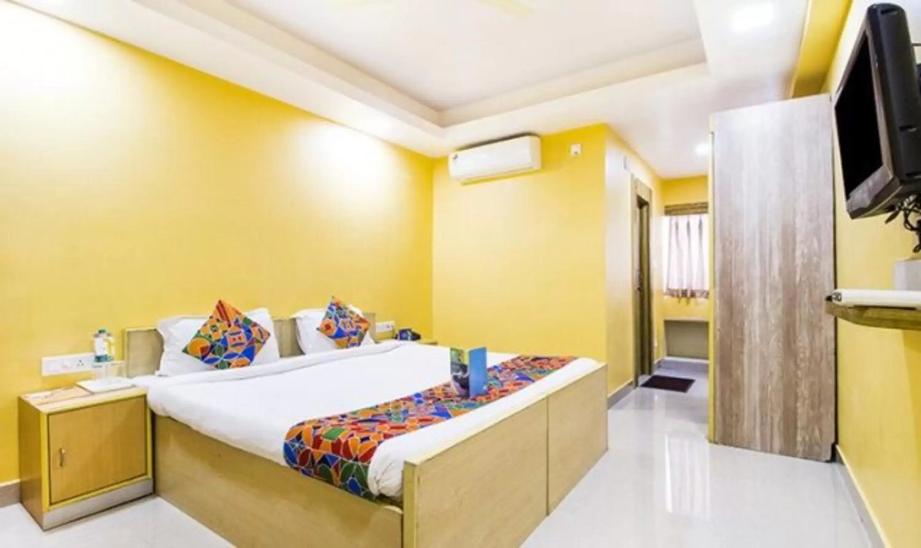 Bed in FabHotel Amaltas