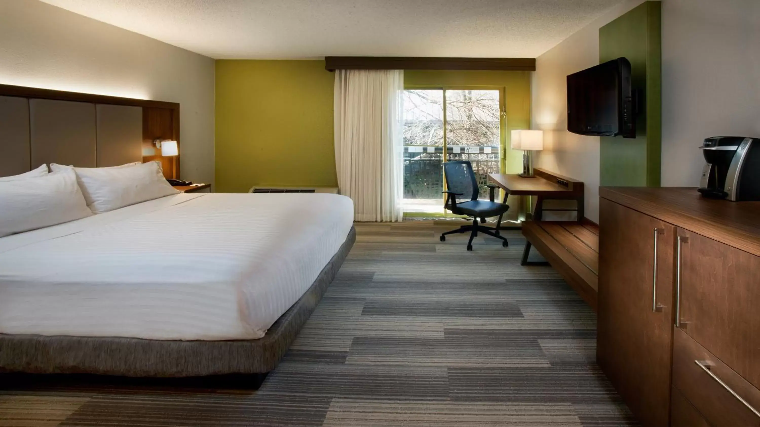 Photo of the whole room, TV/Entertainment Center in Holiday Inn Express Nashville Airport, an IHG Hotel