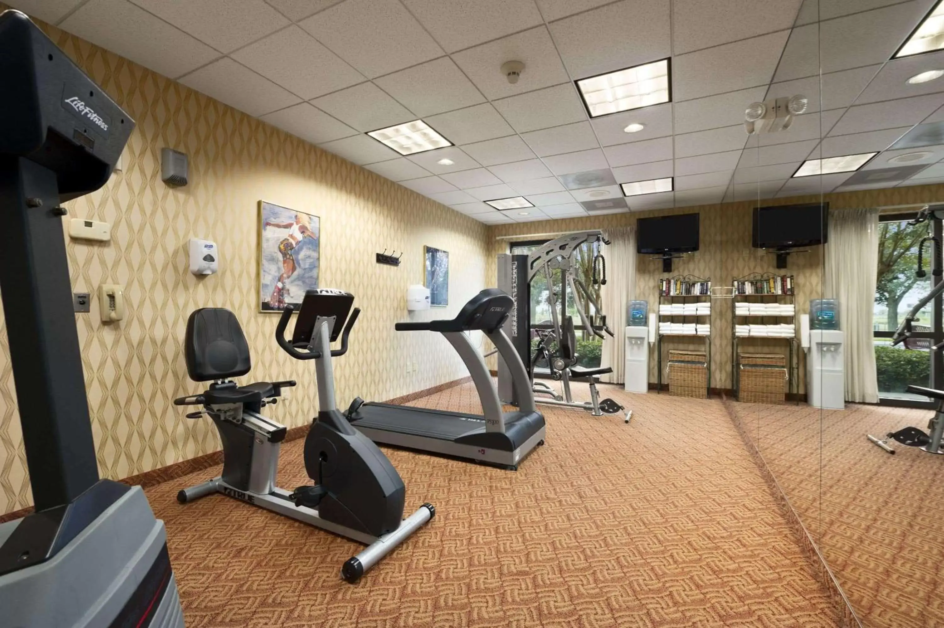 On site, Fitness Center/Facilities in Ramada by Wyndham Suites Orlando Airport