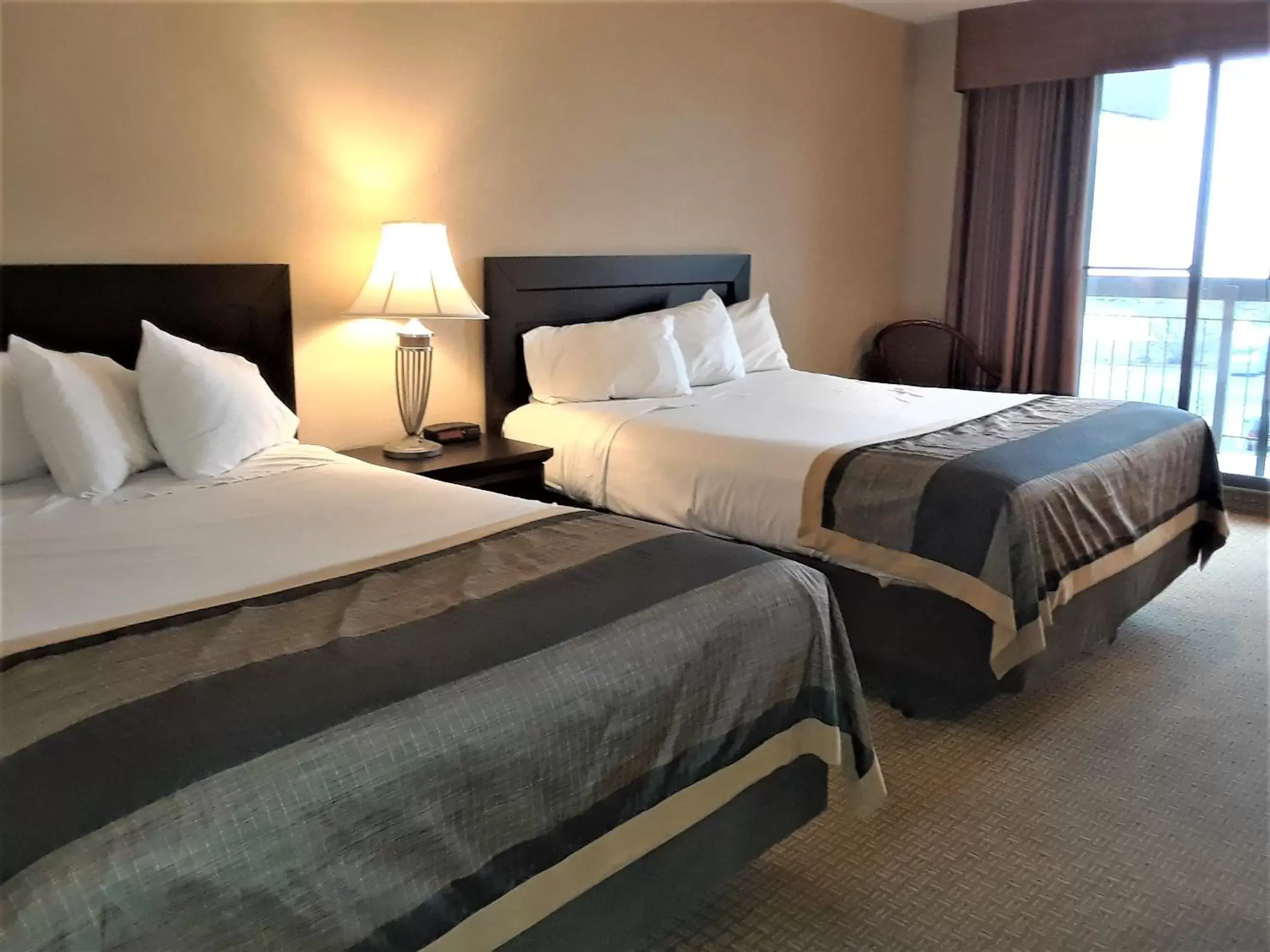 Bed in Ramada by Wyndham Jordan/Beacon Harbourside Resort