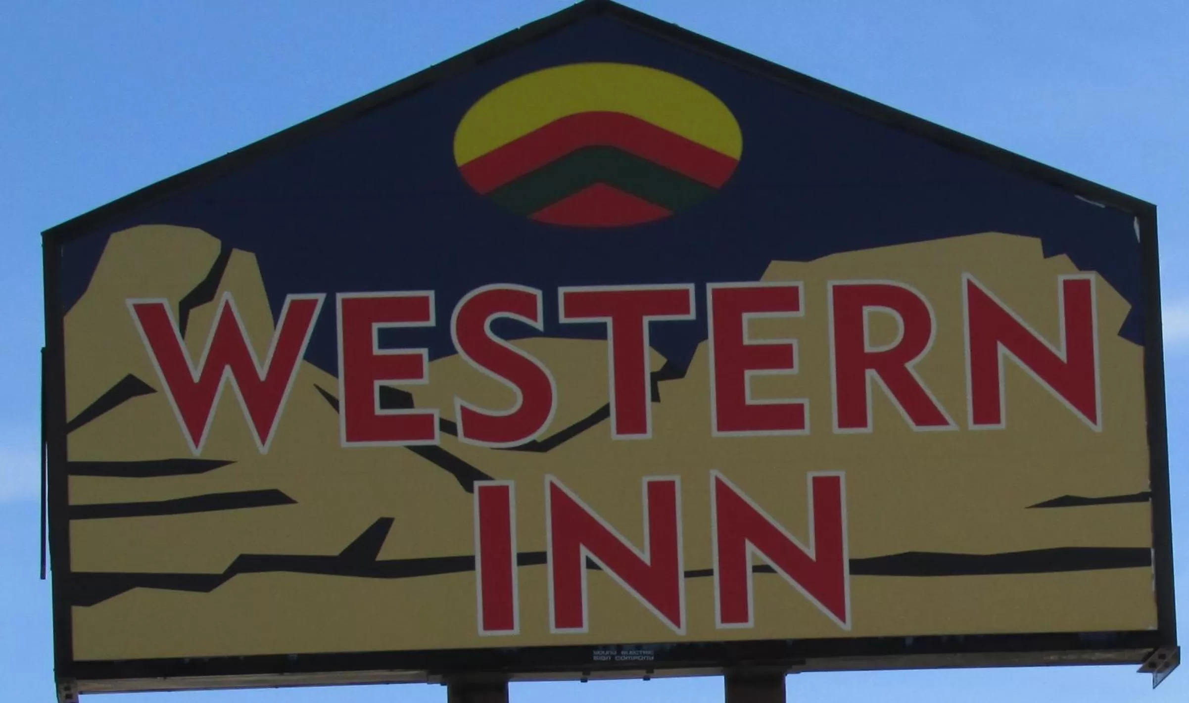 Property logo or sign in Western Inn - Green River