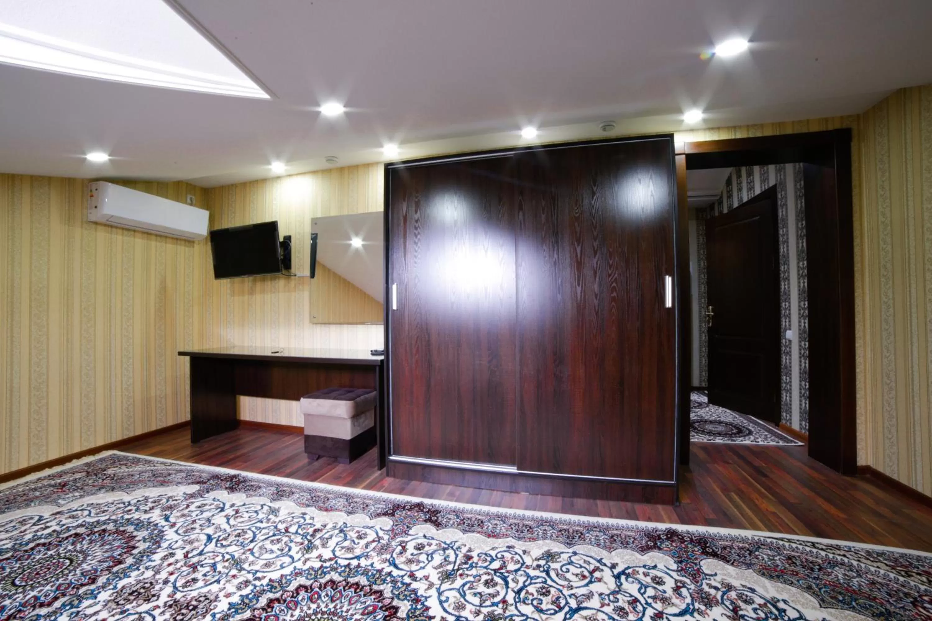 Communal lounge/ TV room, Bed in Alliance Hotel Tashkent