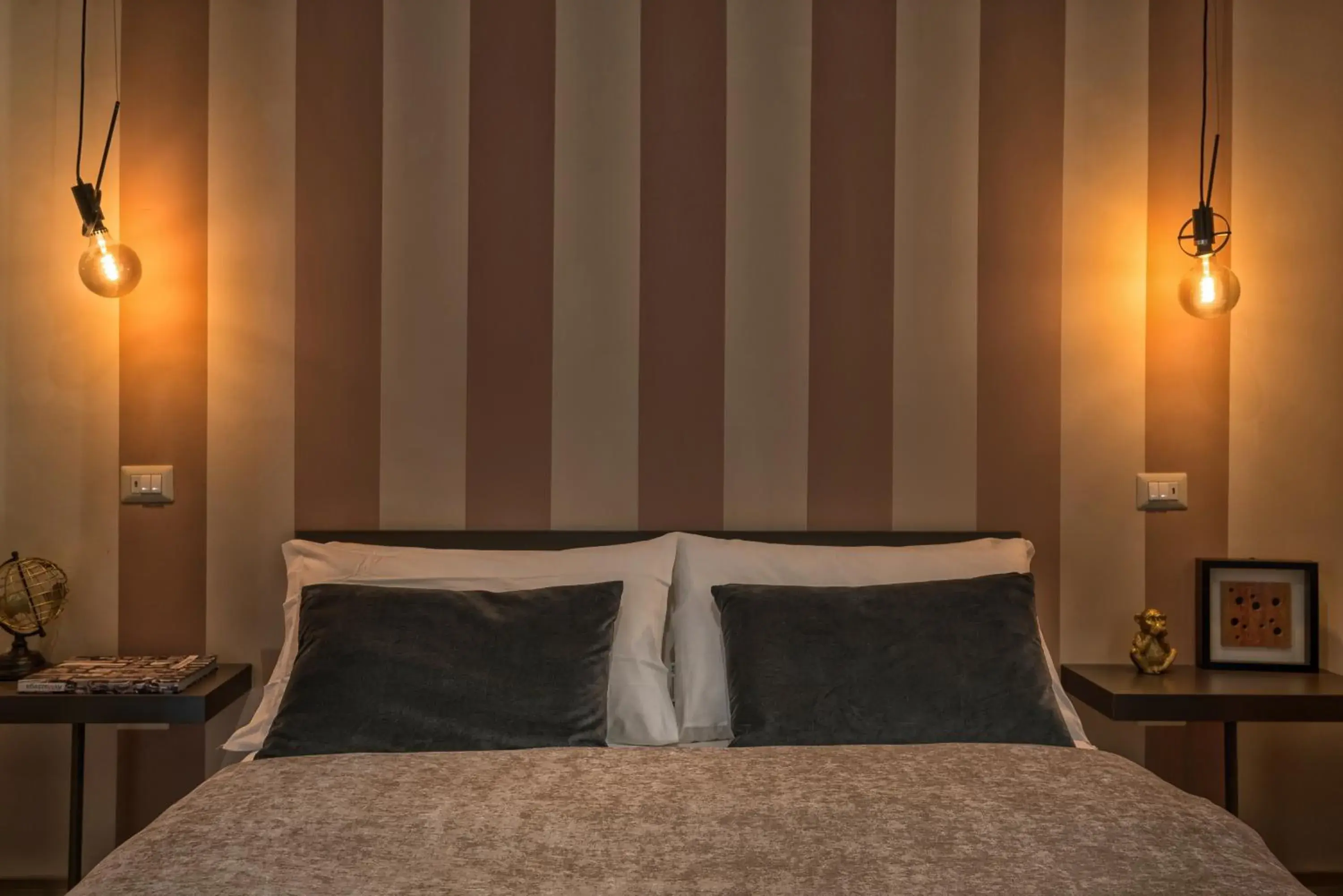 Bed in GOGO` Petit Hotel