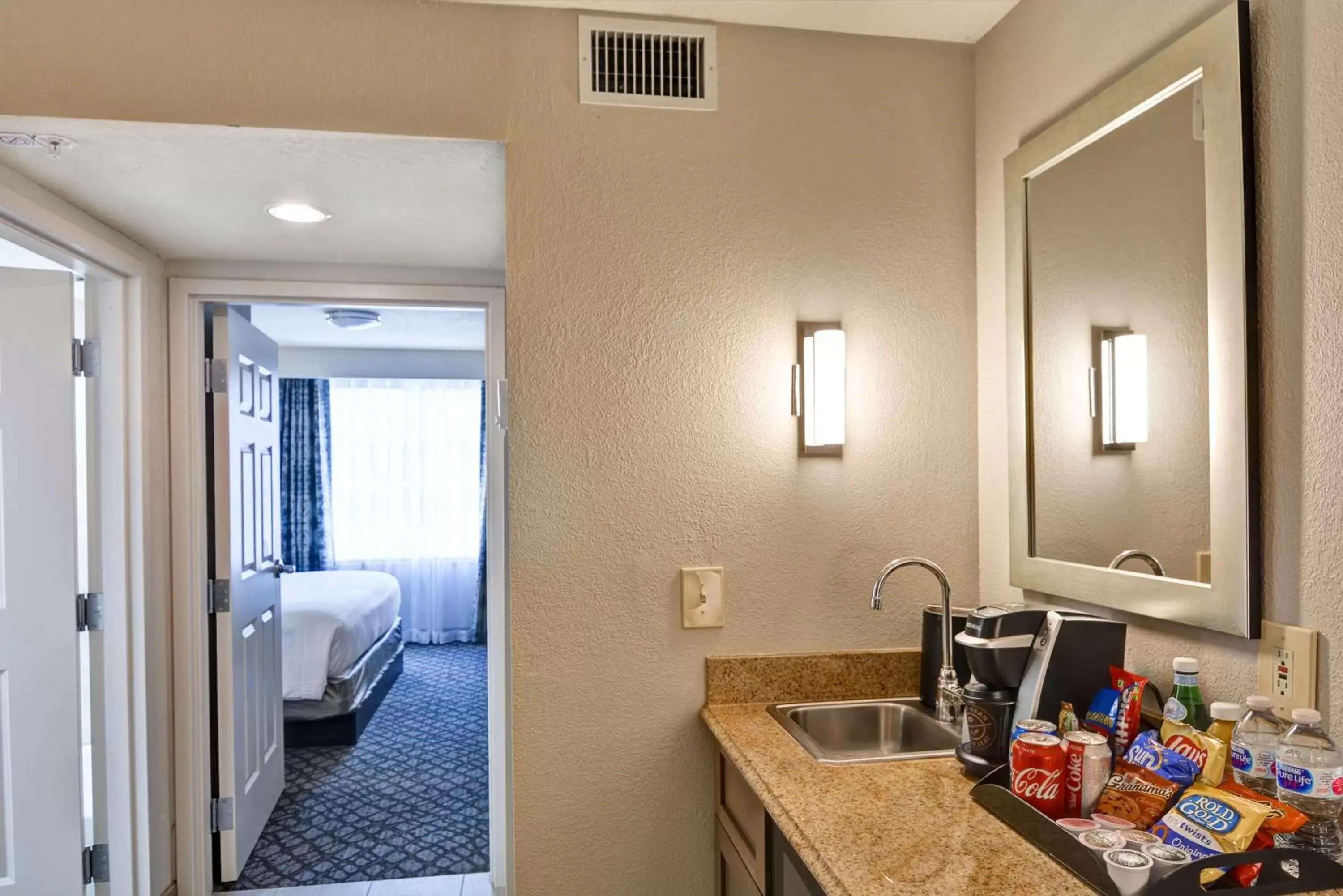 Kitchen or kitchenette, Bathroom in Embassy Suites by Hilton Orlando Downtown