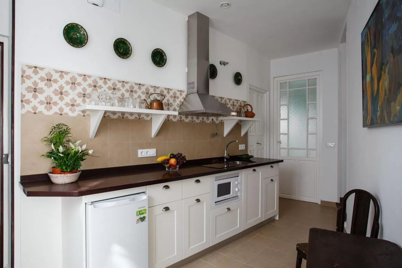 Kitchen or kitchenette in Suites Machado
