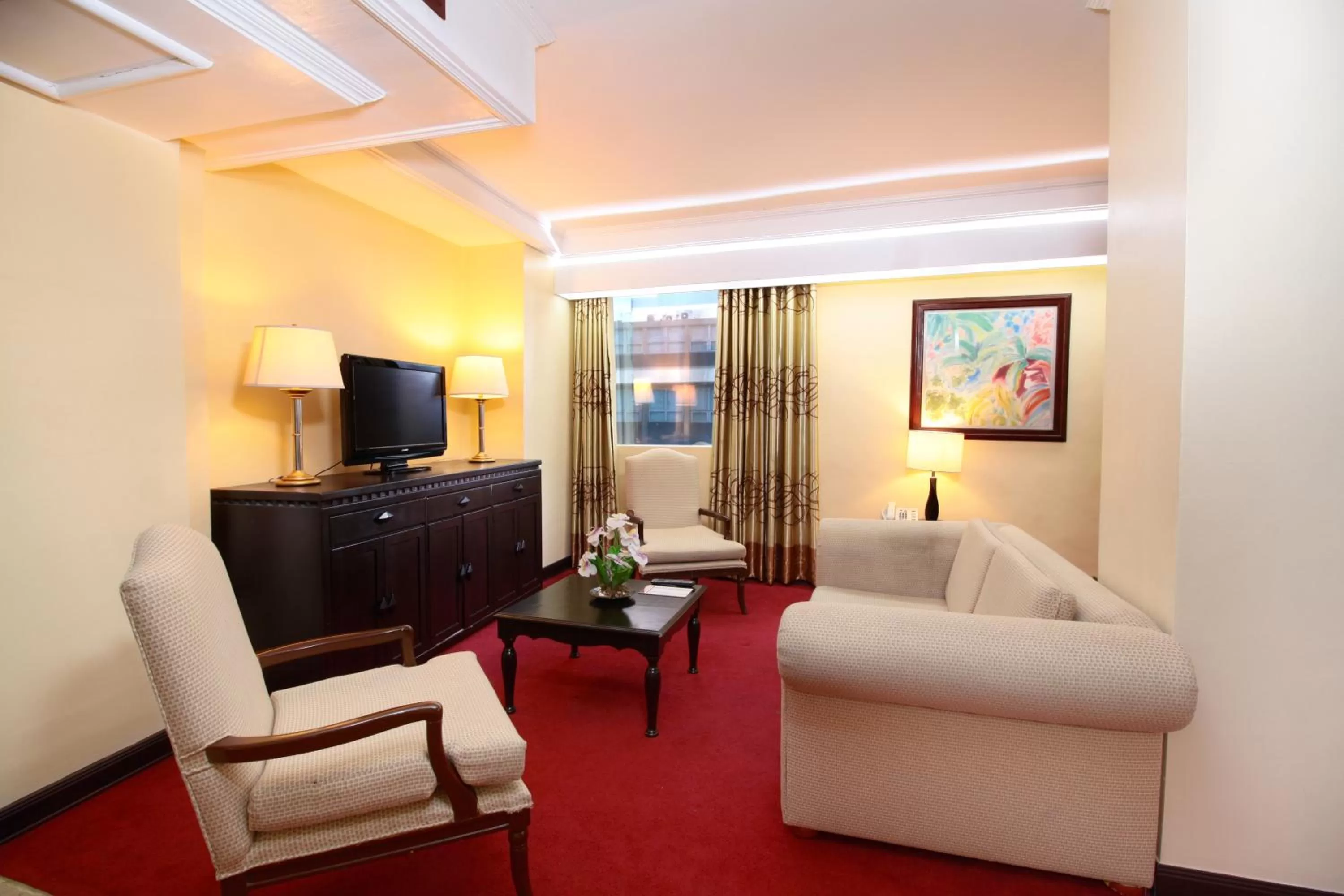 Communal lounge/ TV room in Bayview Park Hotel Manila