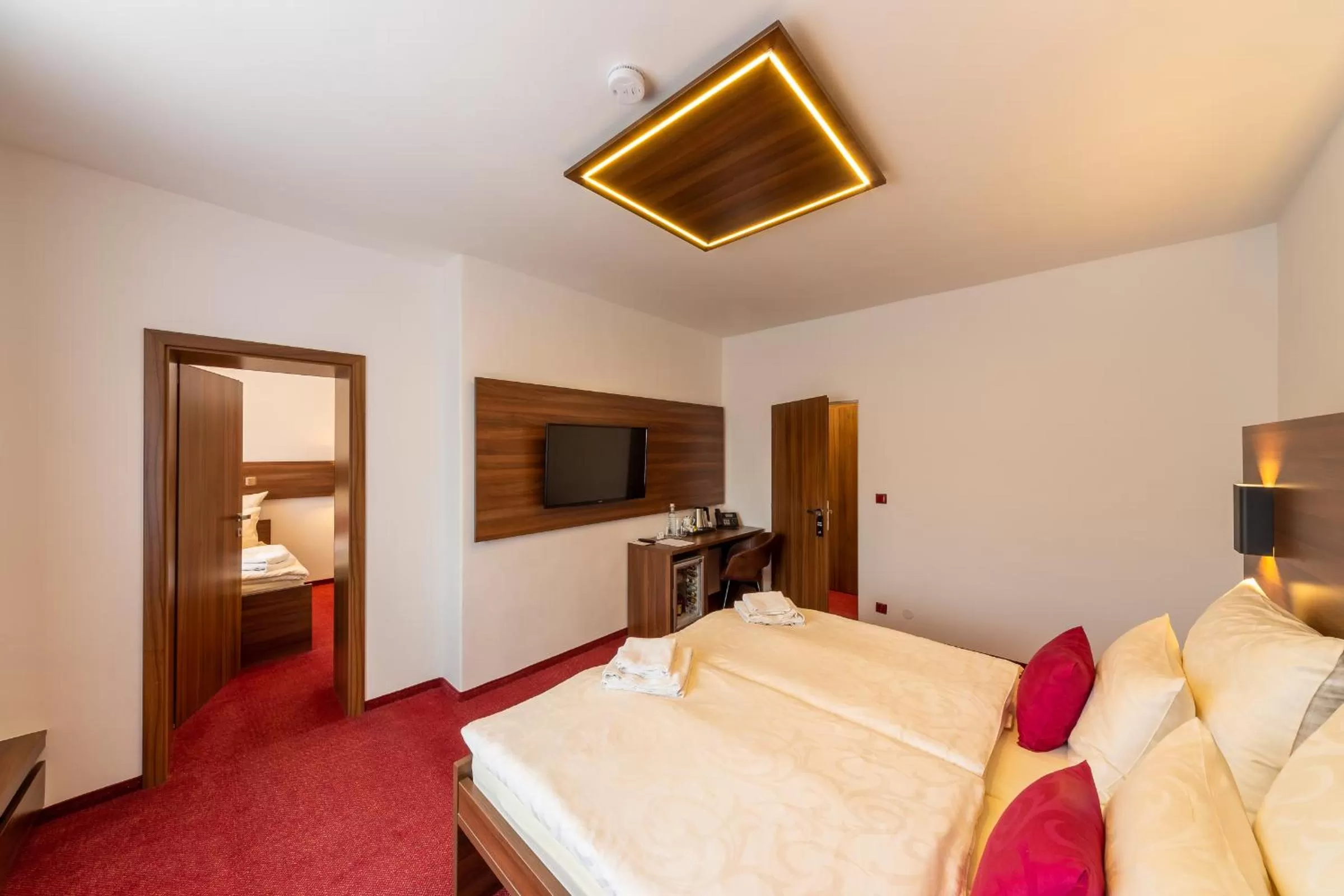 Bed in Bohemia Inn Hotel