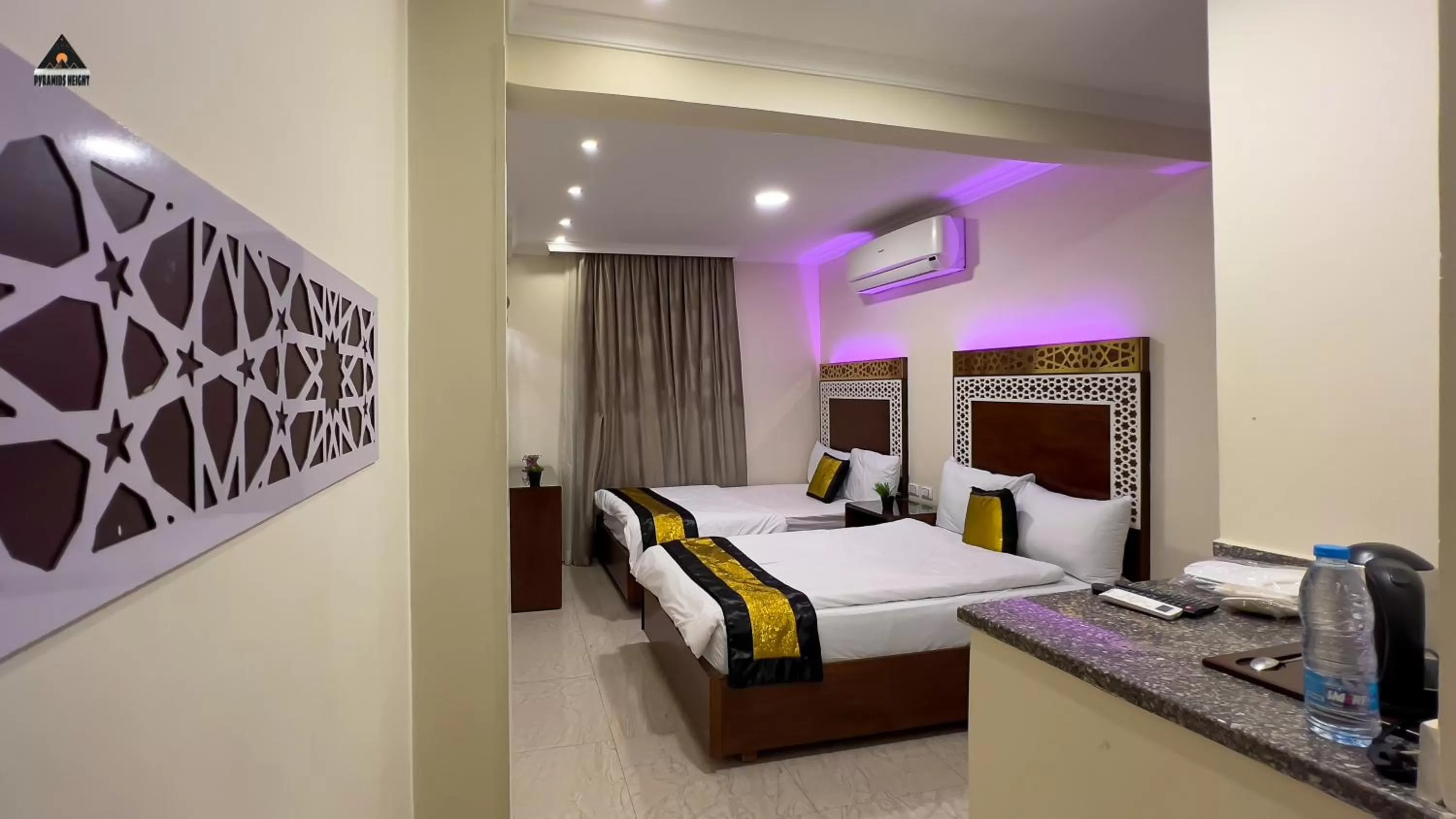 Bed in Pyramids Height Hotel & Pyramids Master Scene Rooftop