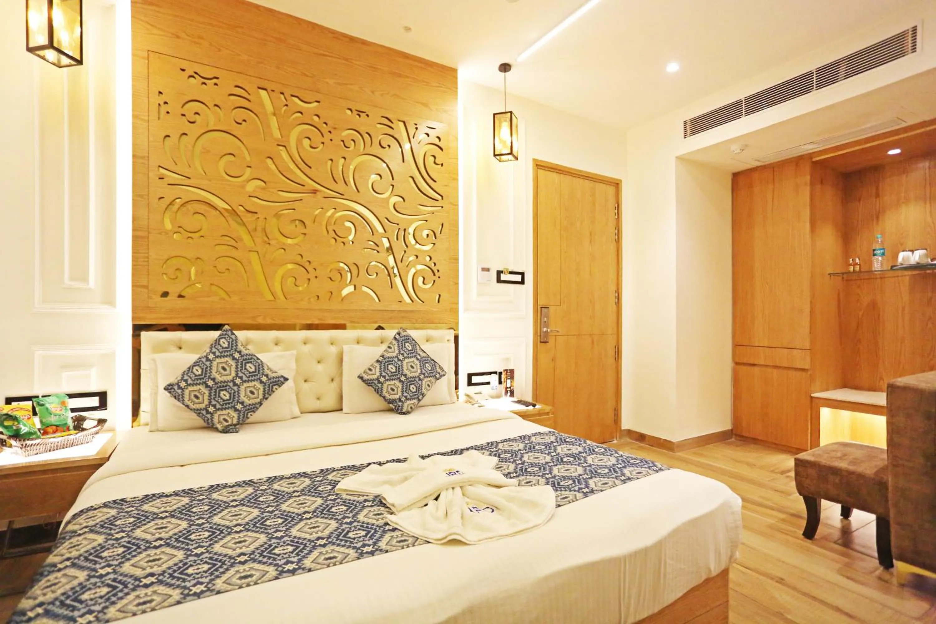 Bed in JRD Luxury-Business Hotel