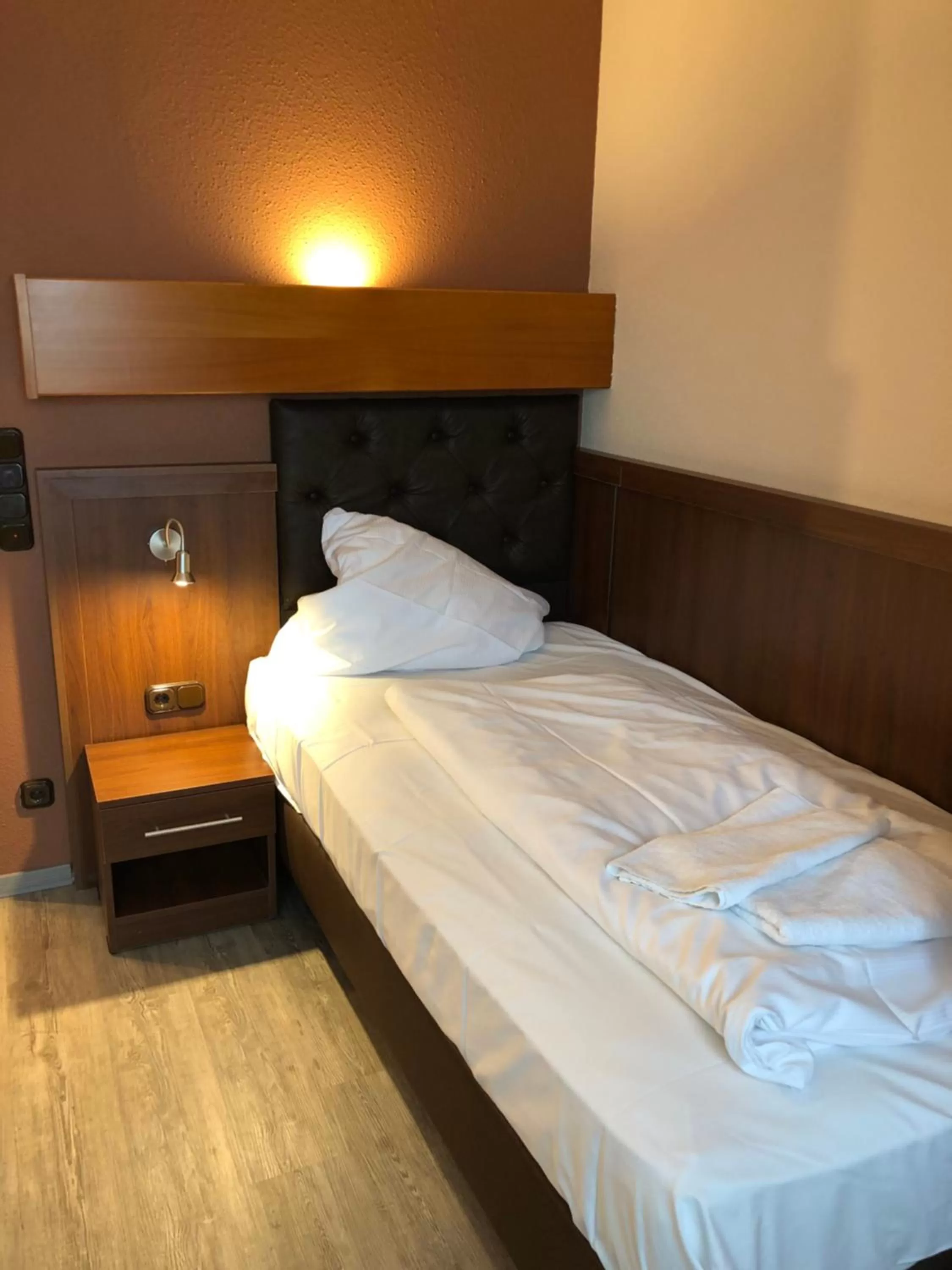 Bed in Hotel Poseidon