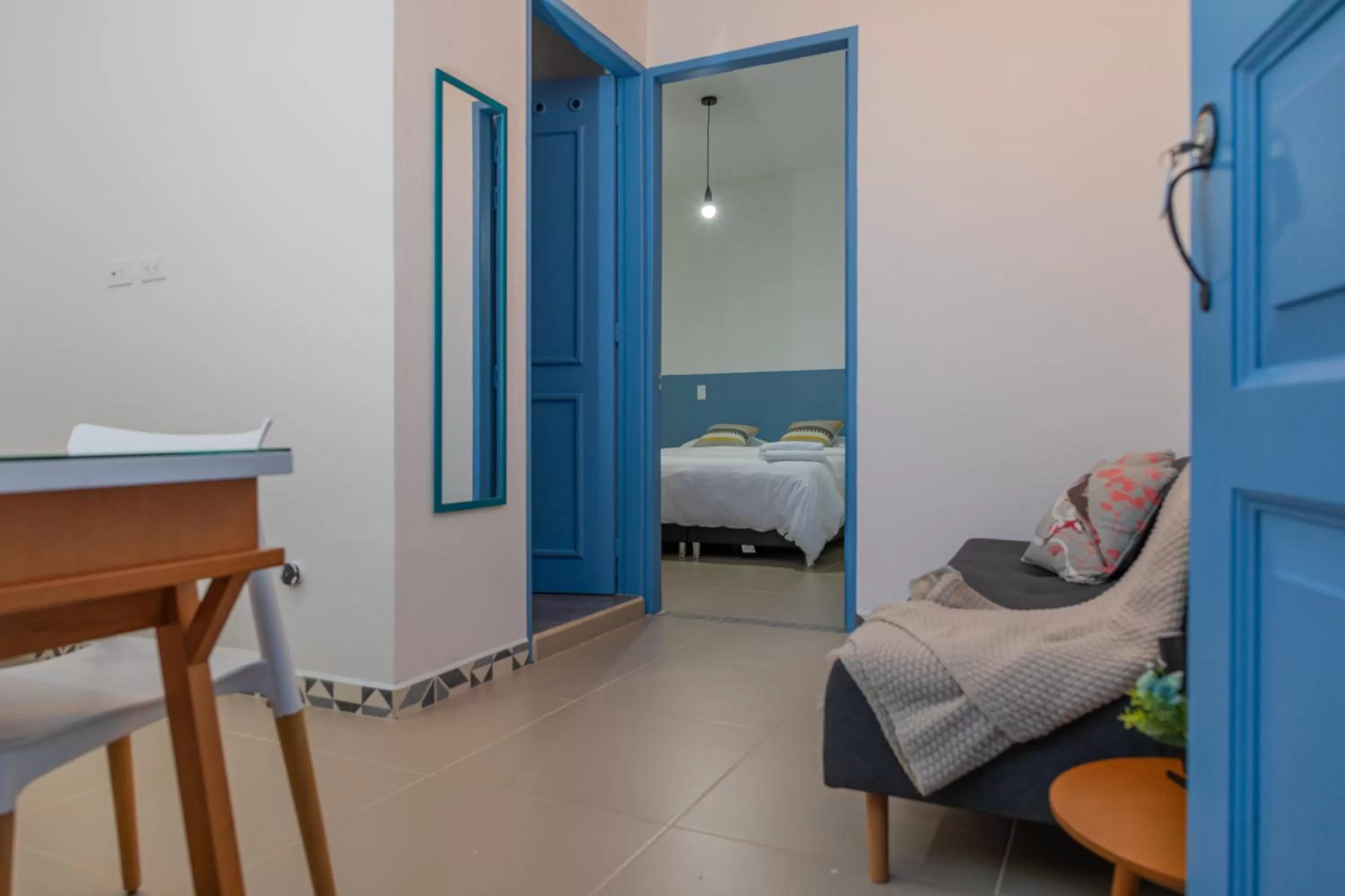 Living room, Bed in Hotel Azulado Jericó