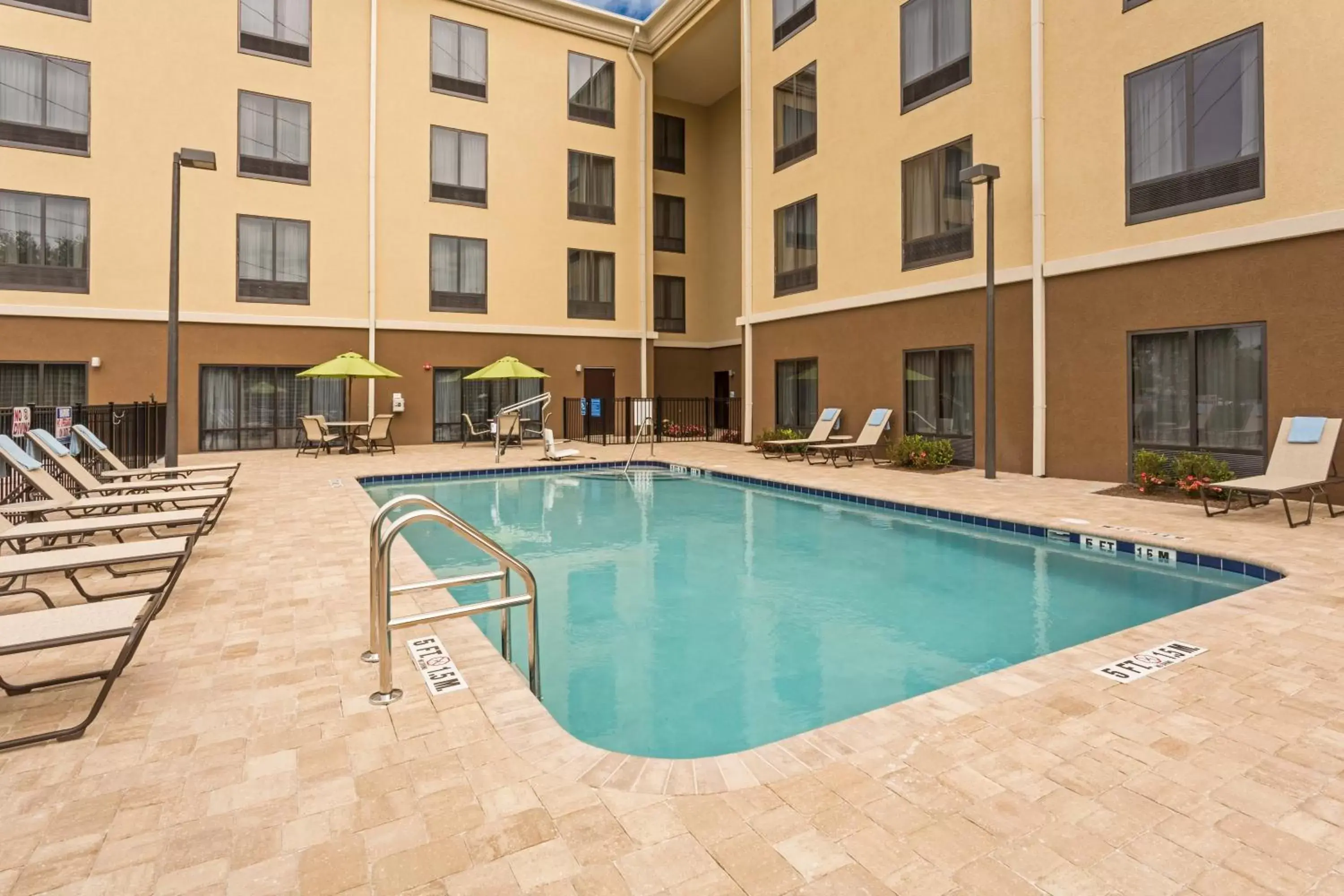 Swimming Pool in Holiday Inn Express Hotel & Suites Orlando East-UCF Area, an IHG Hotel