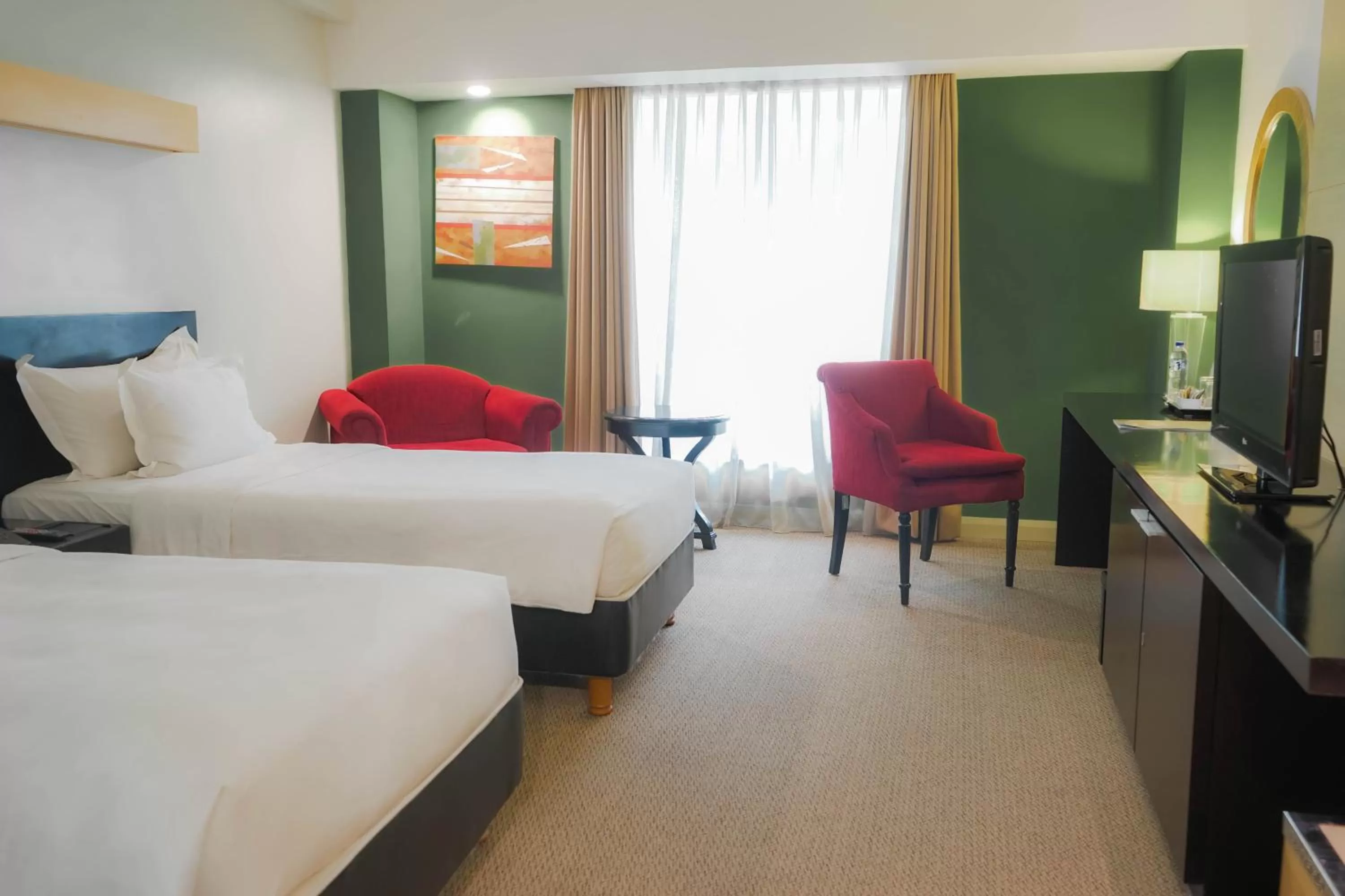 Bed in Grandkemang Hotel