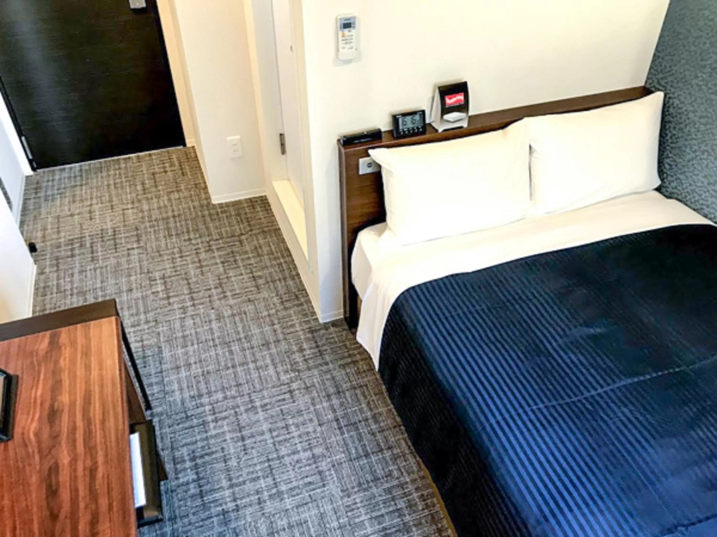 Bed in HOTEL LiVEMAX Chiba Soga-Ekimae