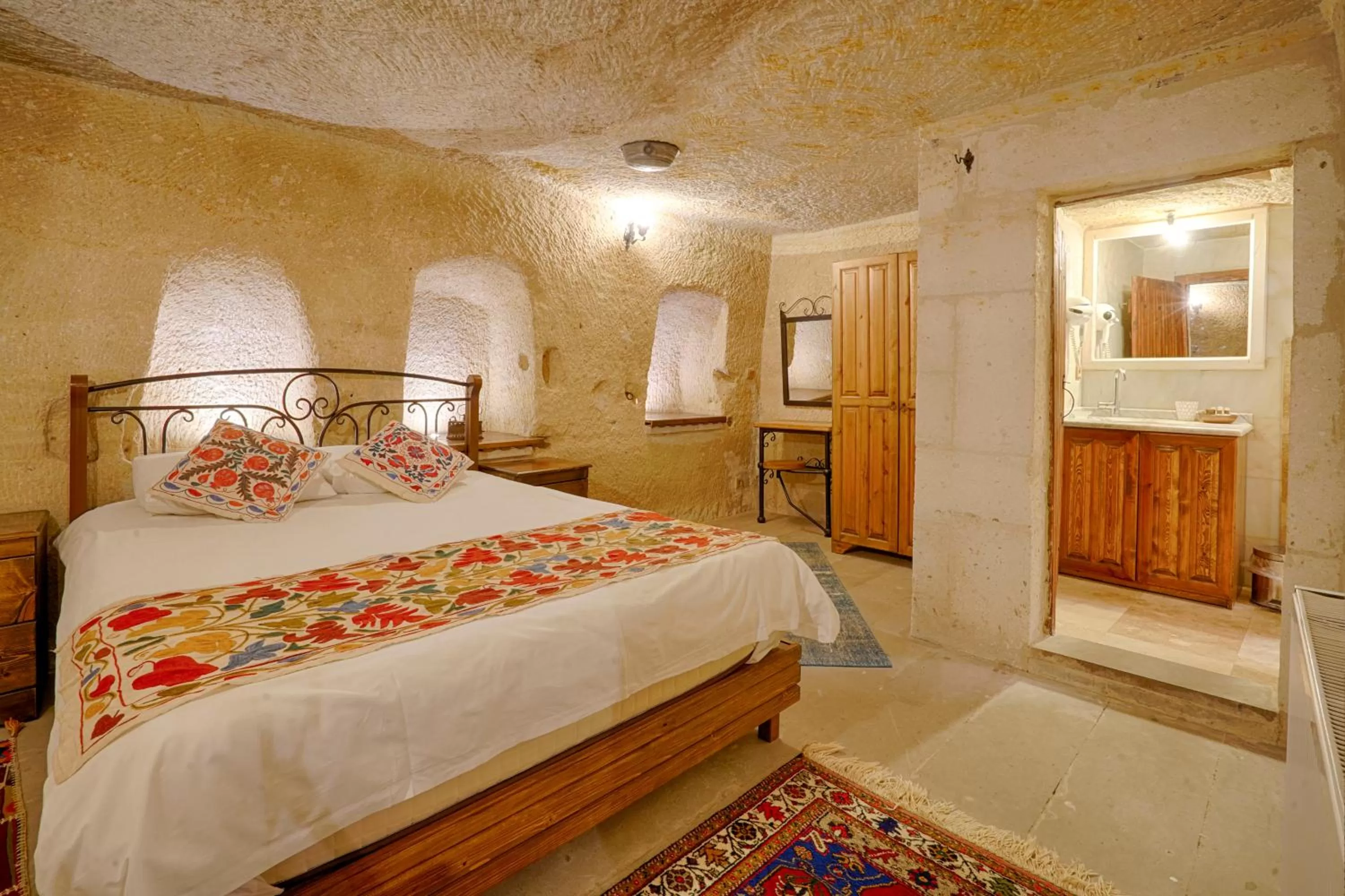 Bed in Tulip Cave Suites