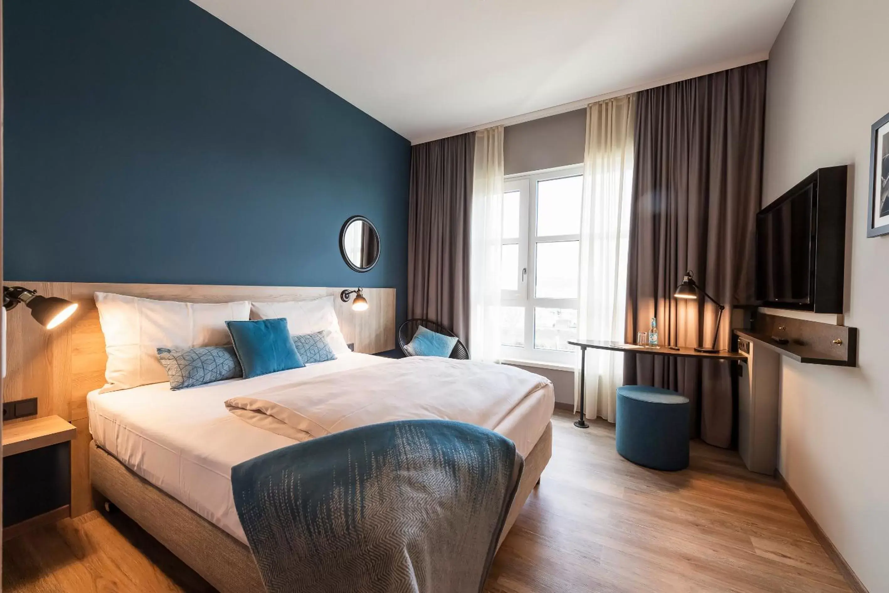 Photo of the whole room, Bed in HARBR. hotel Heilbronn