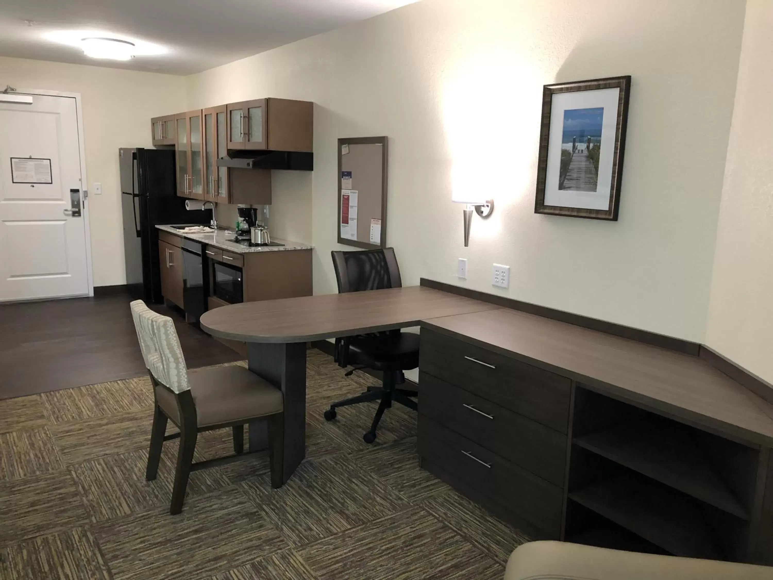 Living room in Candlewood Suites - Panama City Beach Pier Park by IHG Living room in Candlewood Suites - Panama City Beach Pier Park by IHG