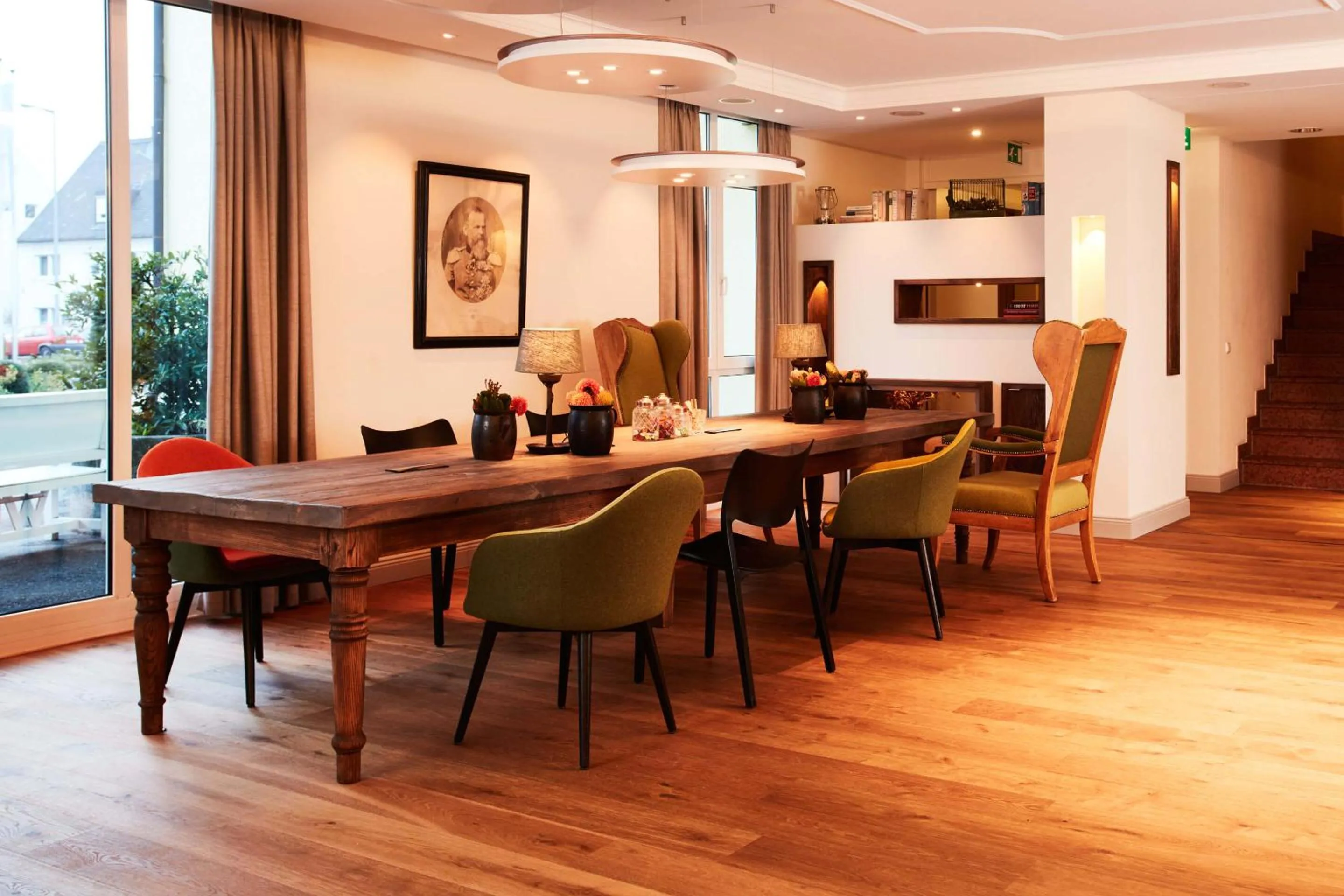 Communal lounge/ TV room in Hotel Prinzregent München Messe