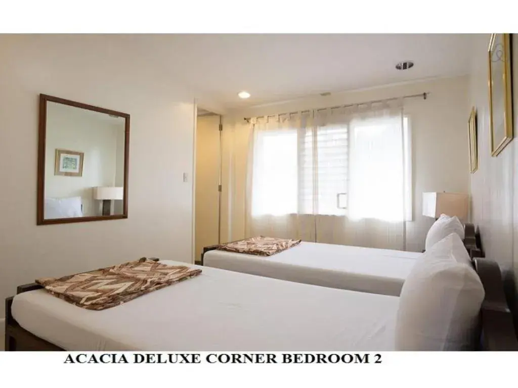 Bed in Agreeable Family Baguio Suites