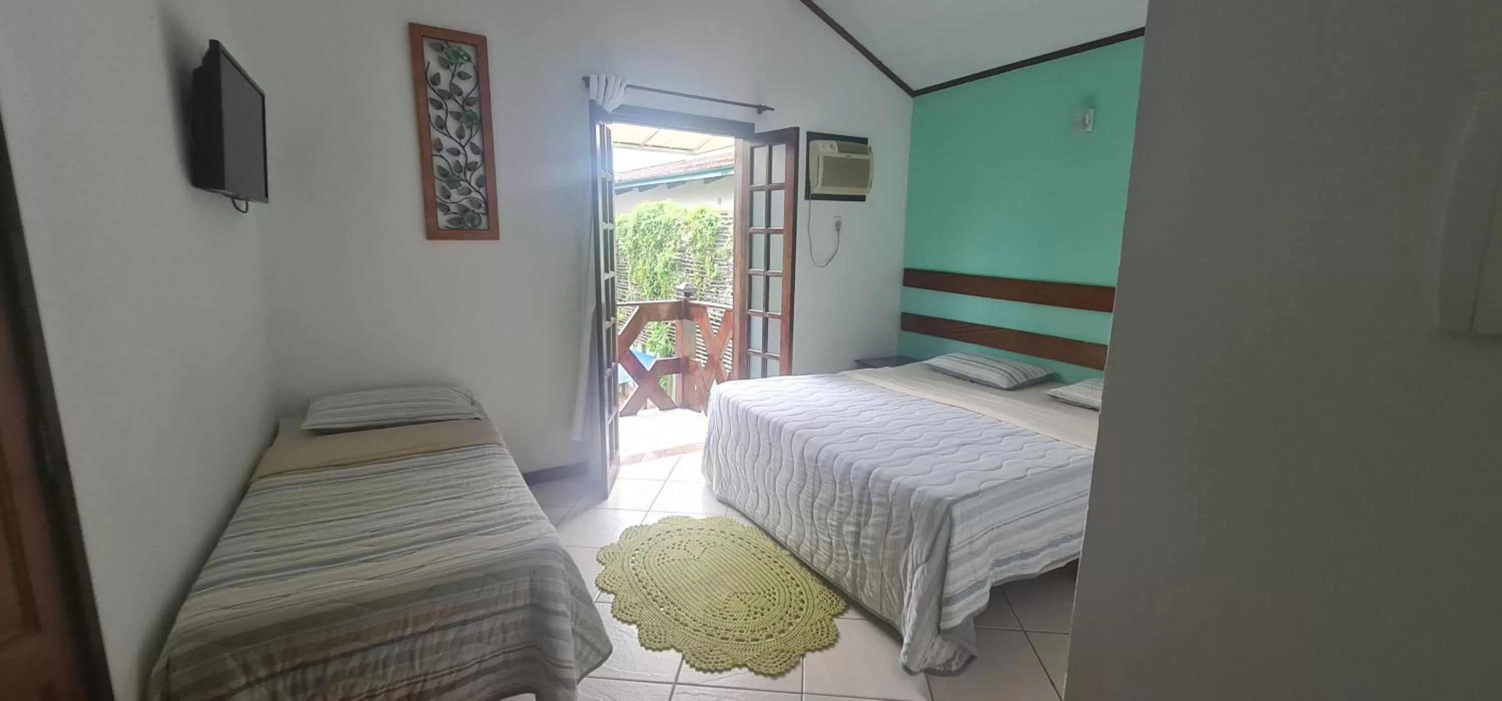 Bed in Pousada Flor de Paraty