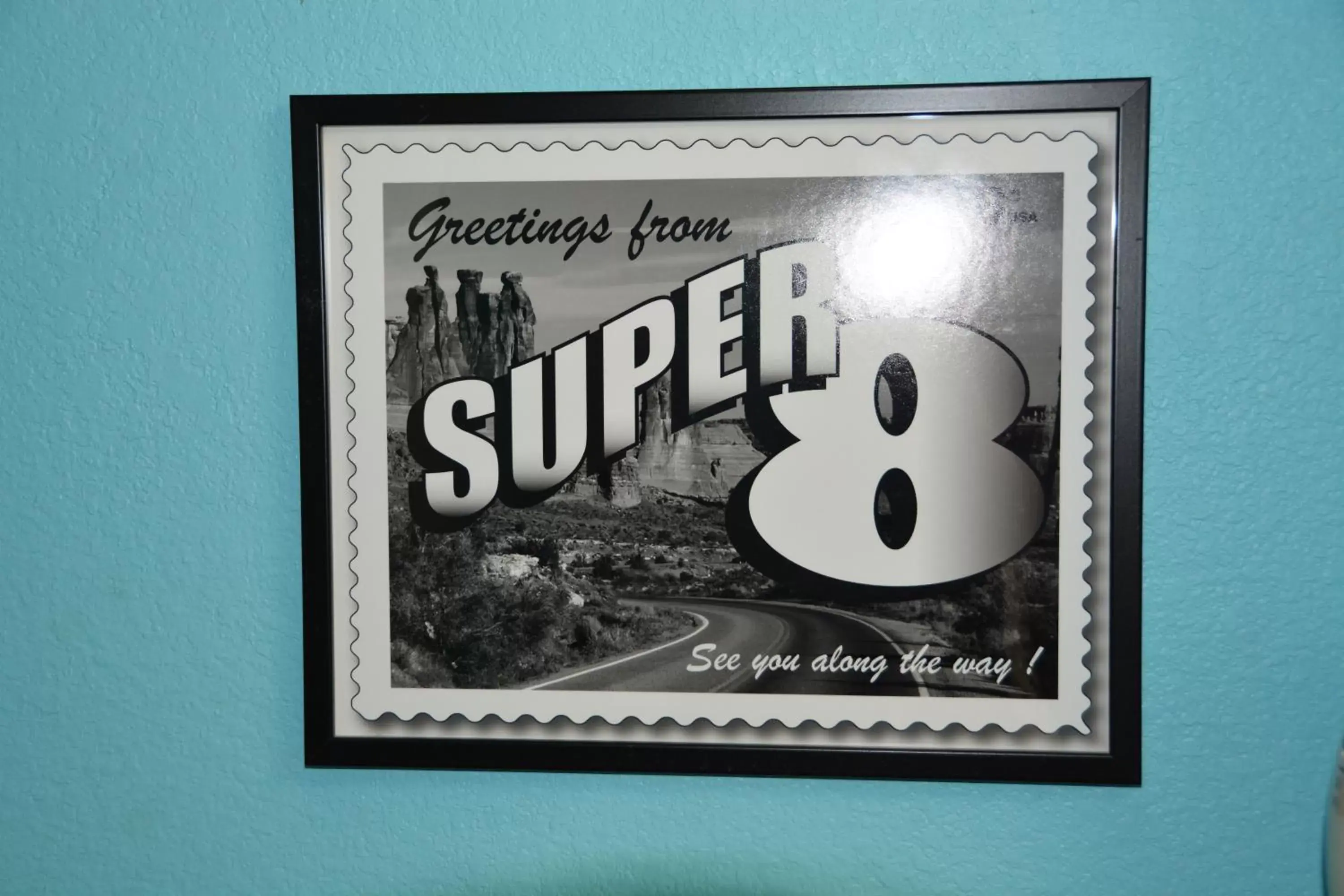 Property logo or sign in Super 8 by Wyndham Austin/Airport South