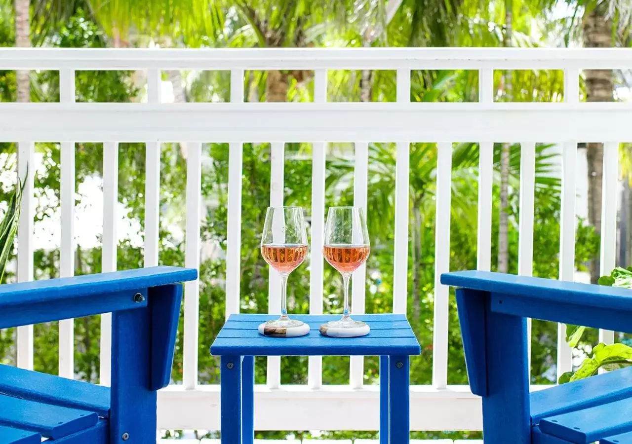 Alcoholic drinks, Balcony/Terrace in Parrot Key Hotel & Villas