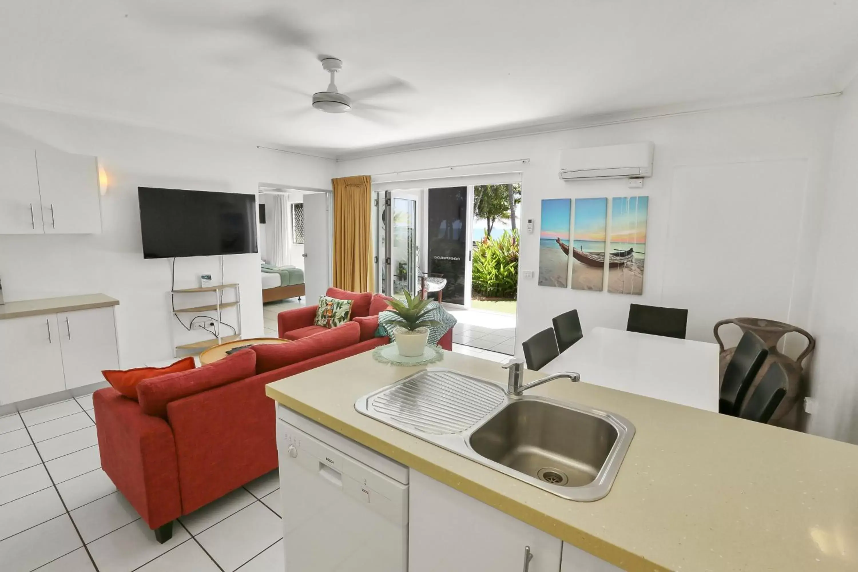 Living room, Kitchen/Kitchenette in Agincourt Beachfront Apartments