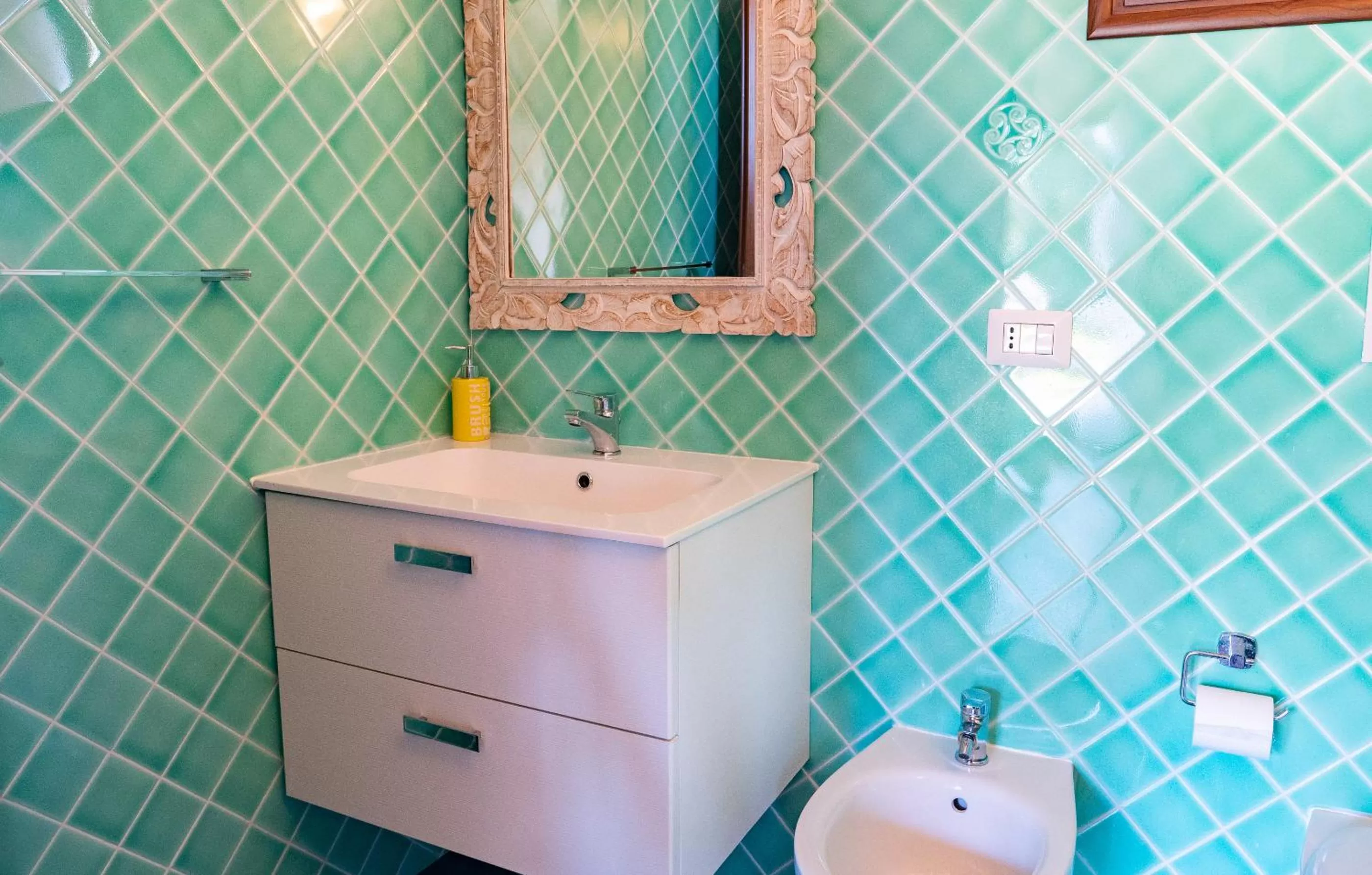 Bathroom in QUADRIFOGLIO Affittacamere