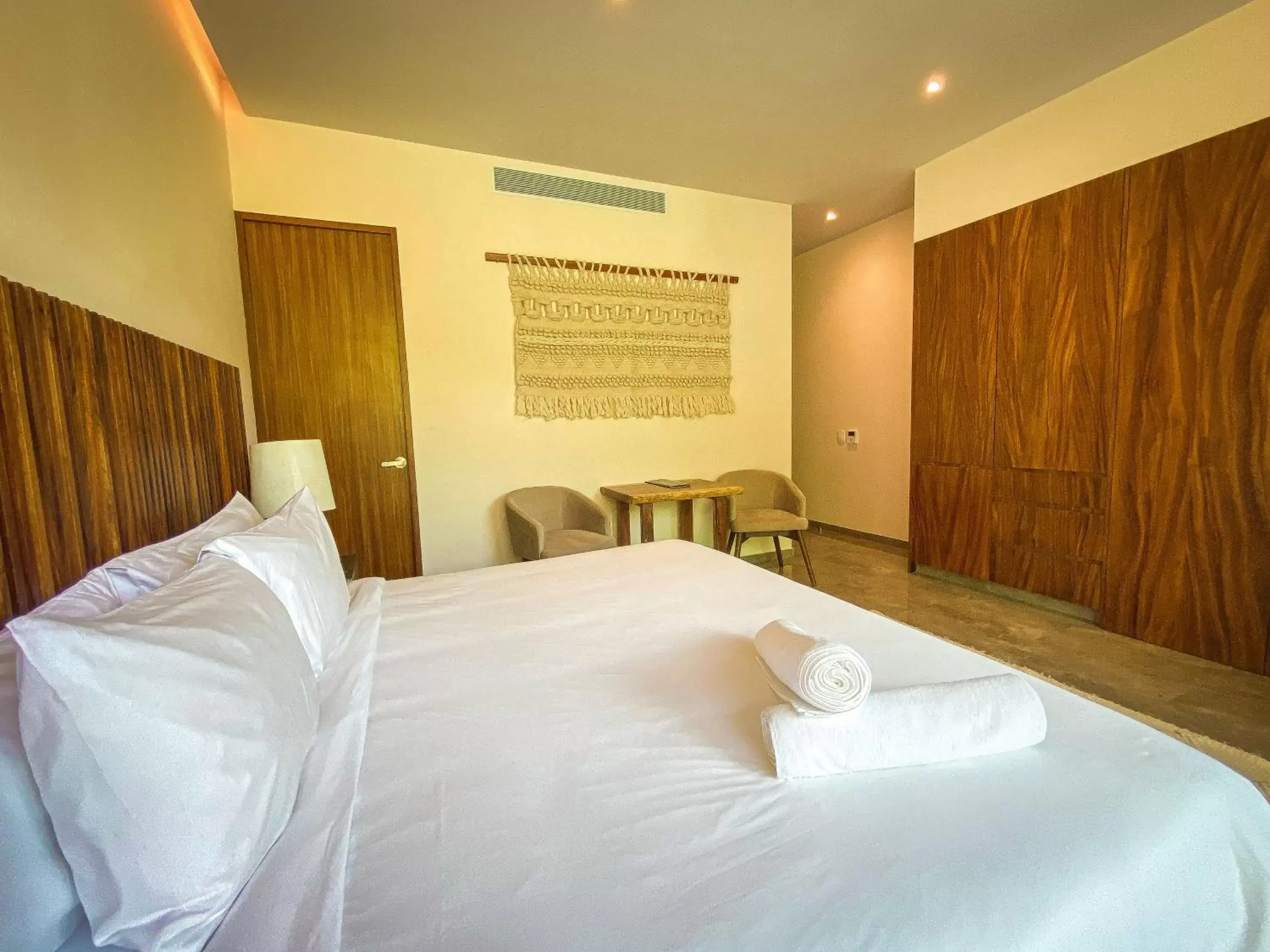 Bed in MISTIQ Tulum Luxury Apartments