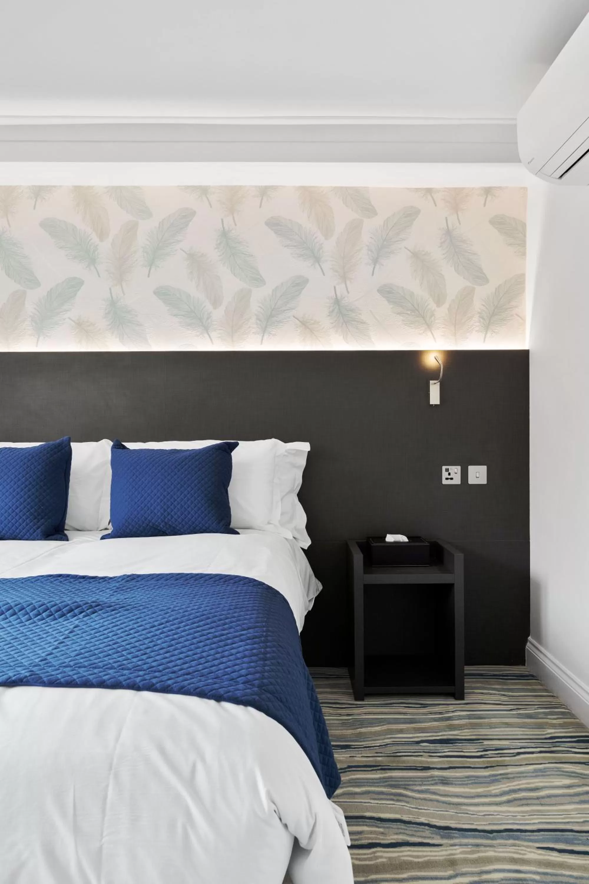 Bed in Commodore Hotel