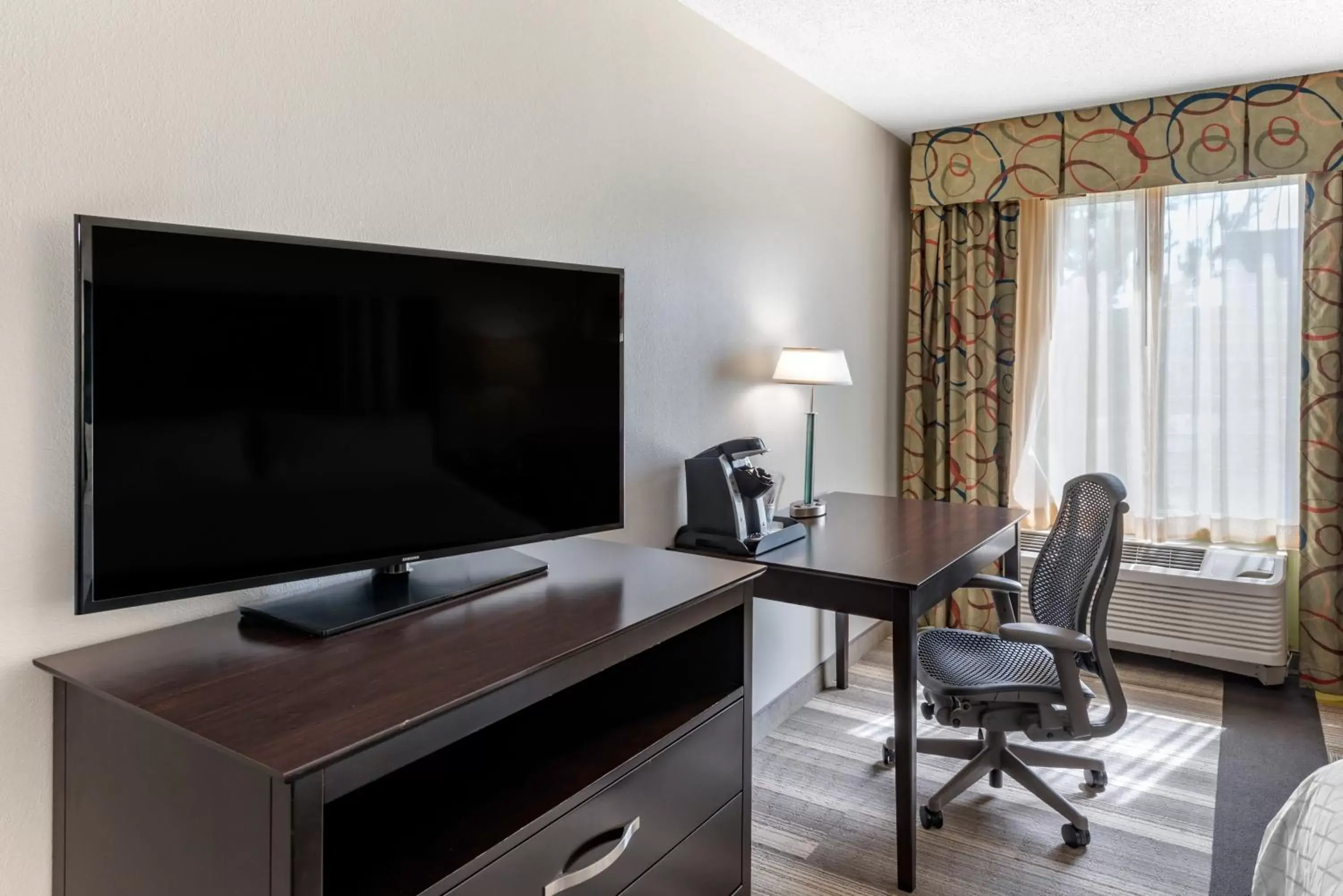 Photo of the whole room, TV/Entertainment Center in Holiday Inn Express Hotel & Suites Cincinnati-Blue Ash, an IHG Hotel