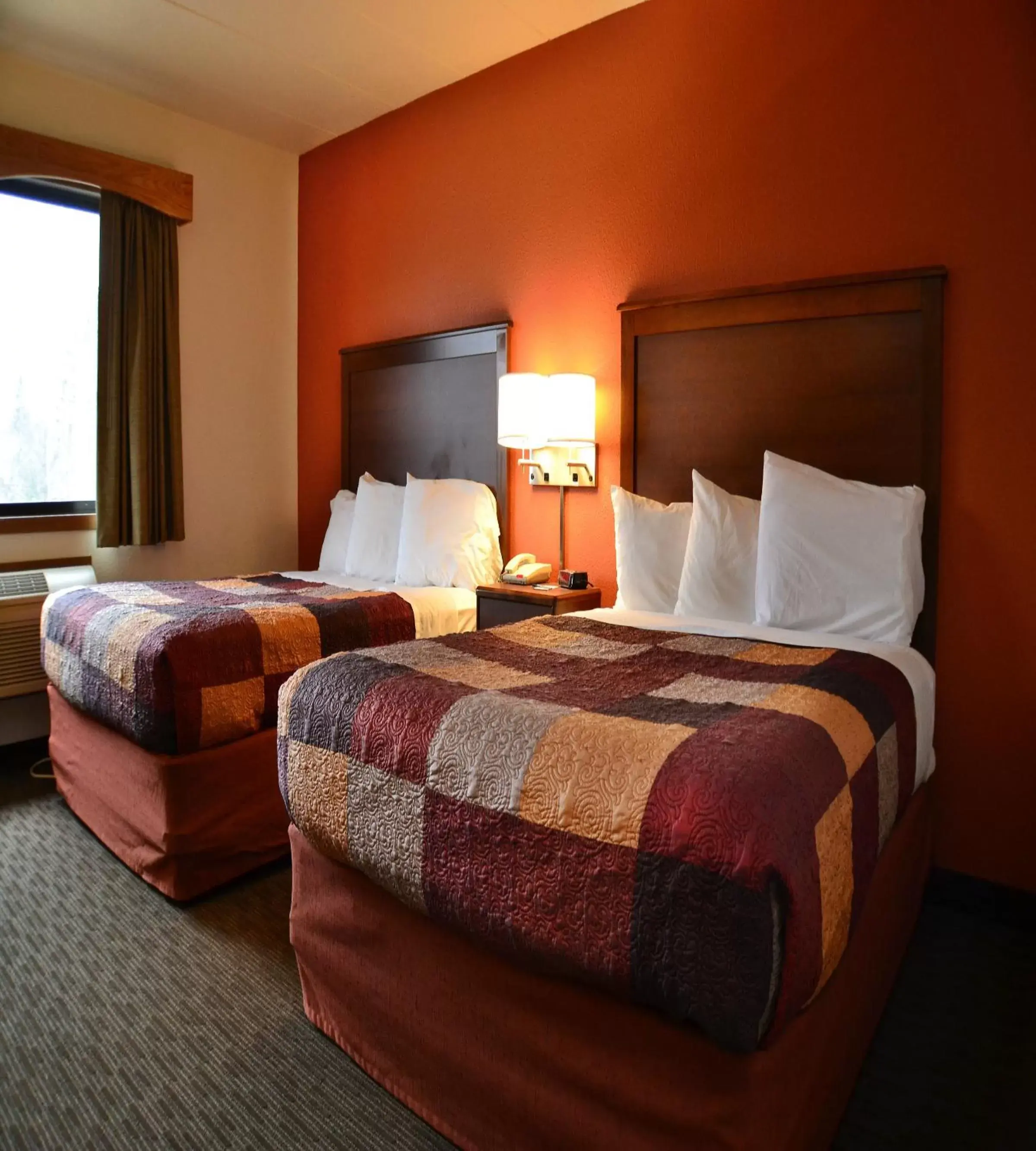 Bed in AmericInn by Wyndham Calumet