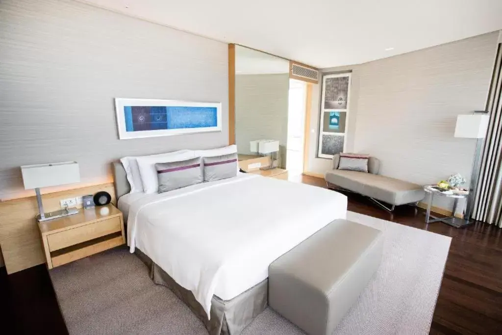 Bed in Avani Plus Riverside Bangkok Hotel