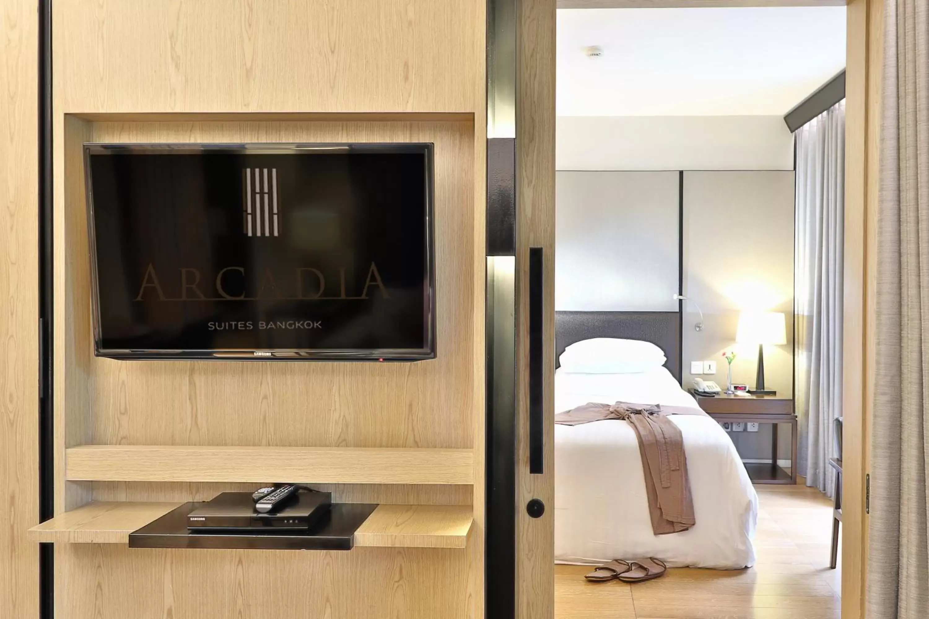 Bedroom, TV/Entertainment Center in Arcadia Suites Bangkok