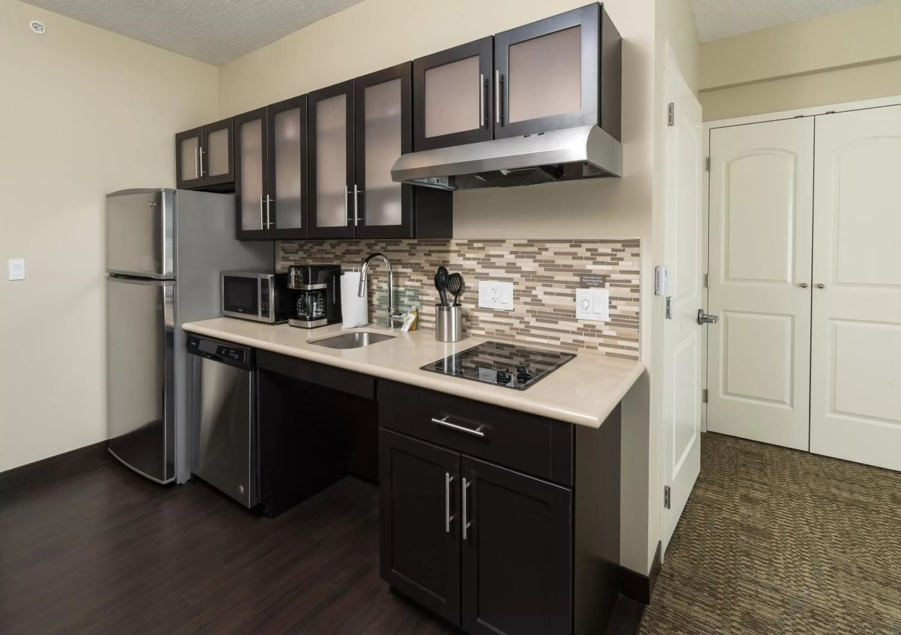 Photo of the whole room, Kitchen/Kitchenette in Staybridge Suites - Saskatoon - University, an IHG Hotel