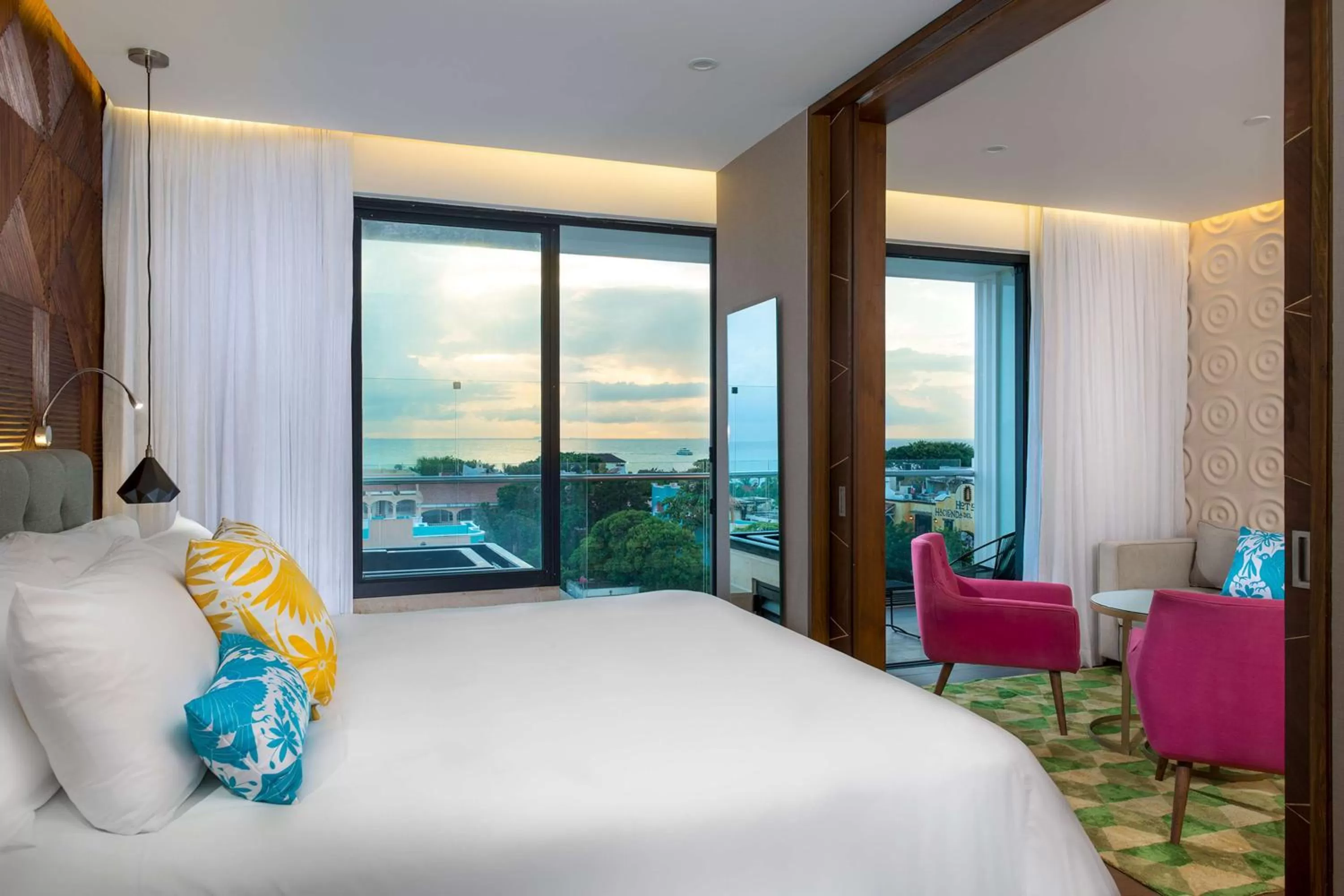 Living room, Bed in The Fives Downtown Hotel & Residences, Curio Collection by Hilton