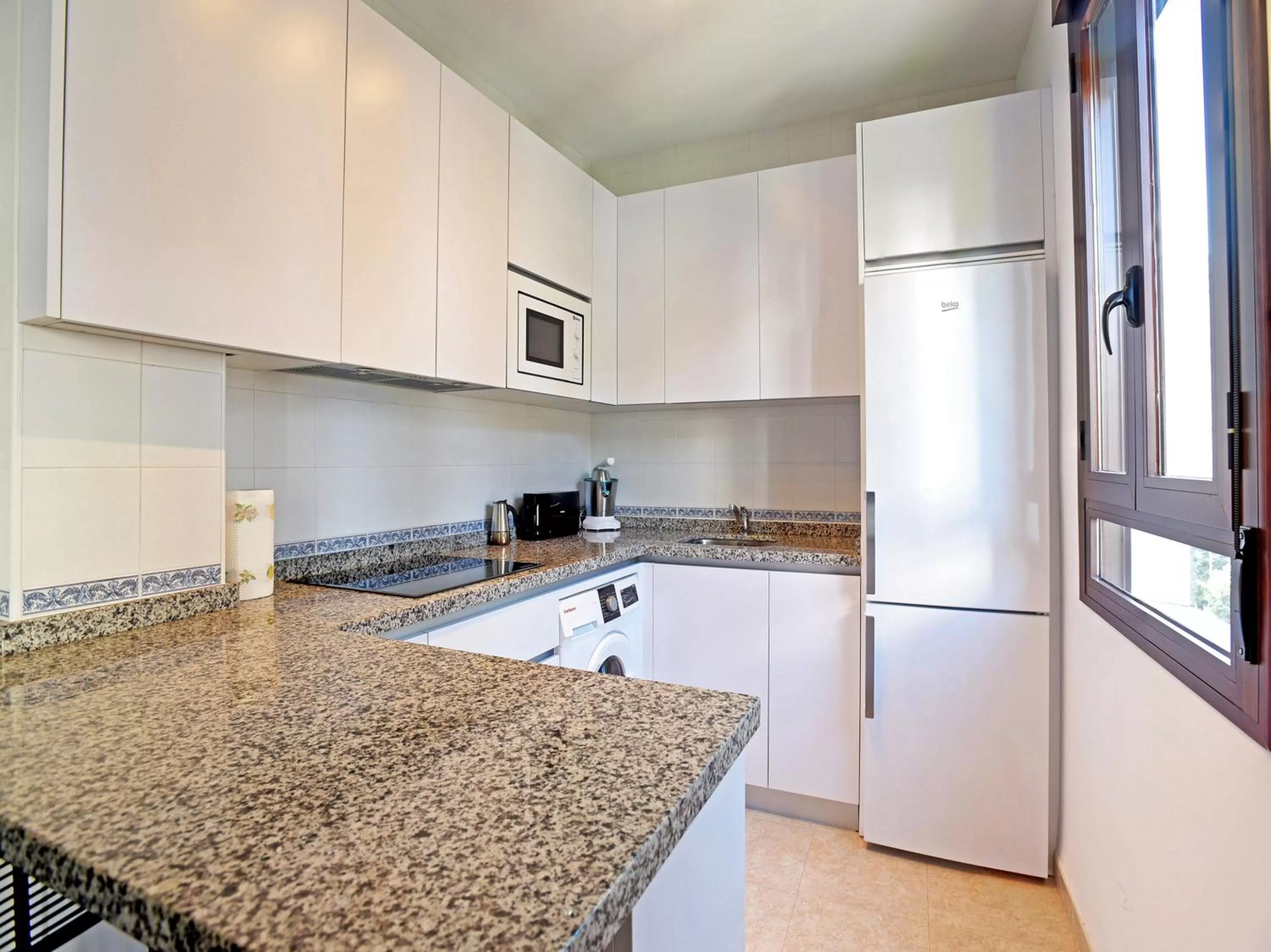 Kitchen or kitchenette in Apartamentos Santiago