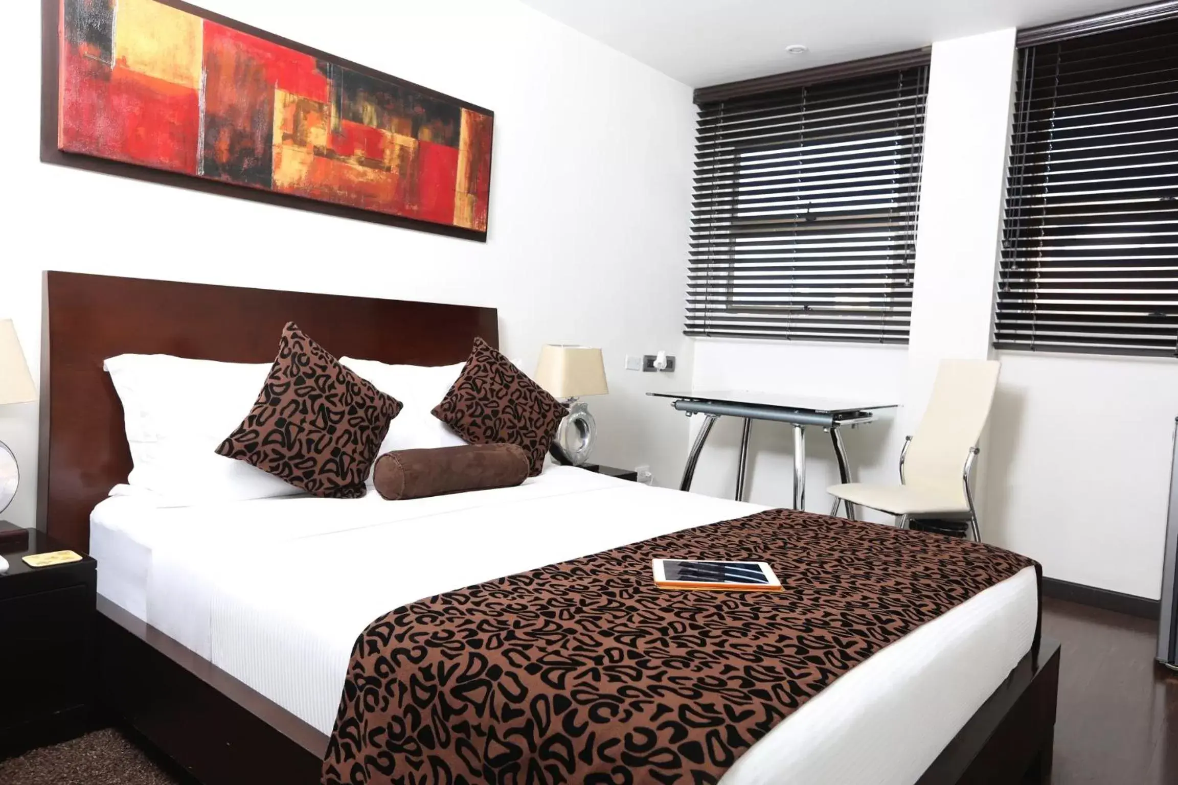 Bed in Hotel Suites 108