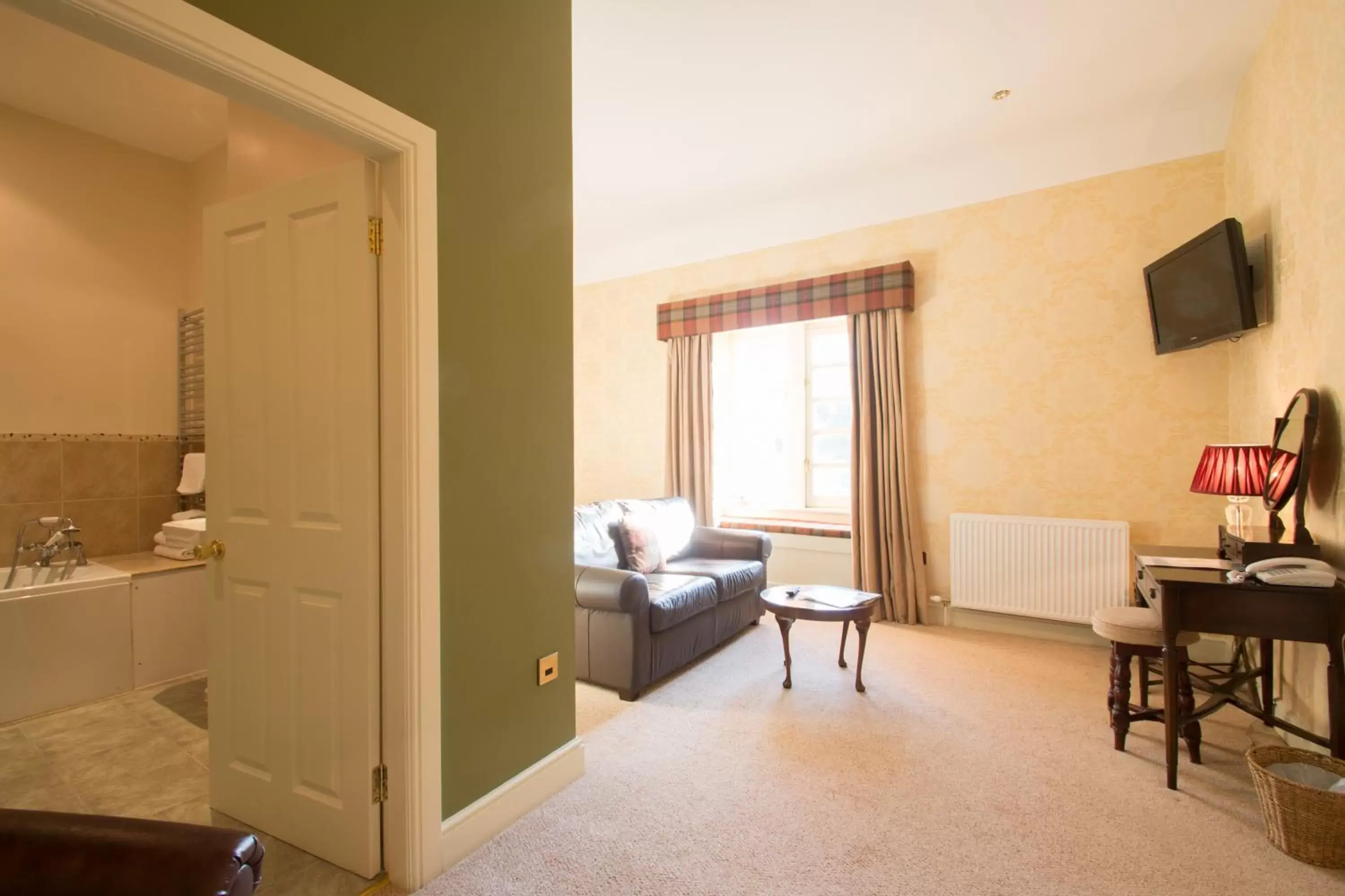 Bed, Seating Area in Blackaddie House Hotel