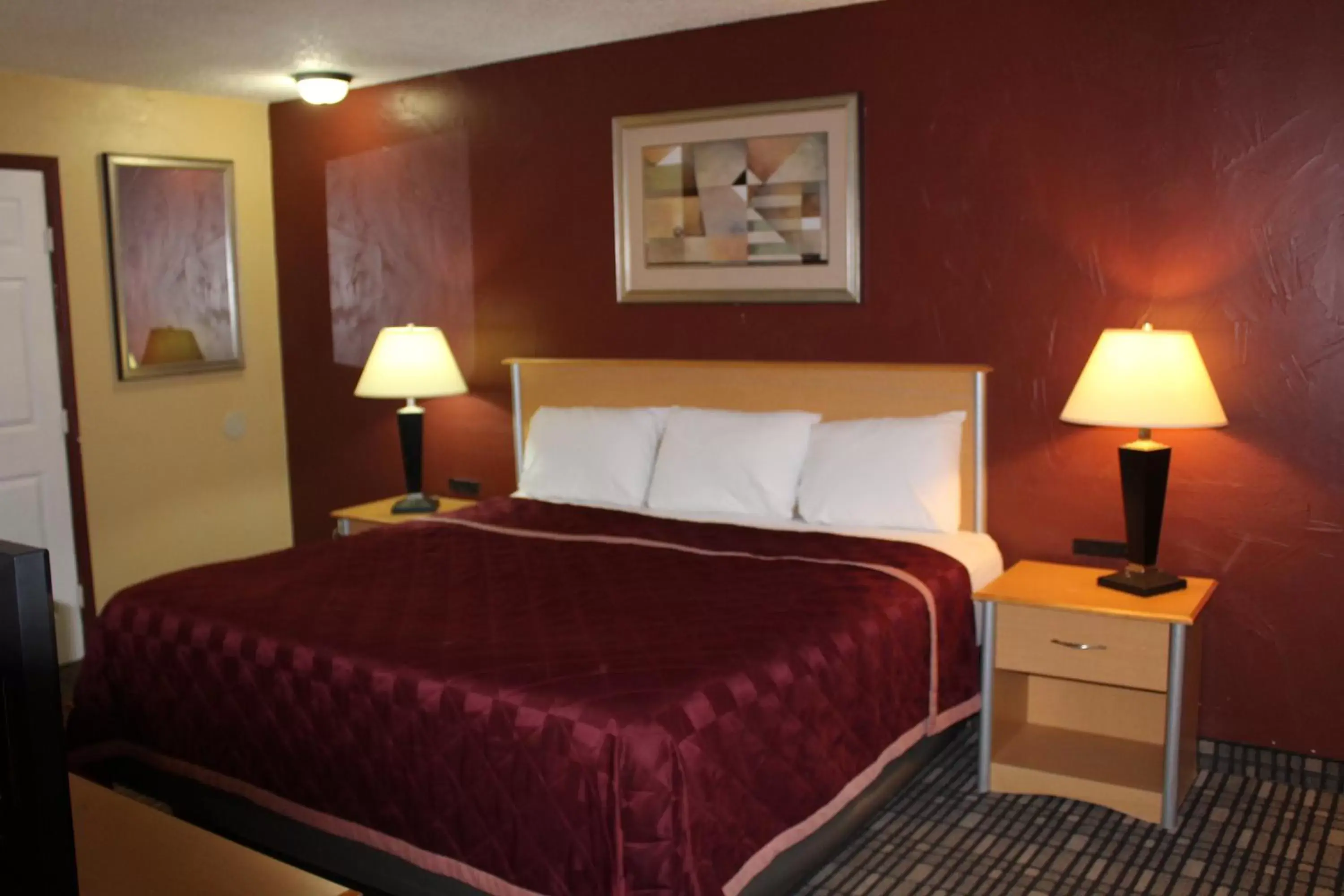 Bed in The Executive Inn & Suites Bed in The Executive Inn & Suites