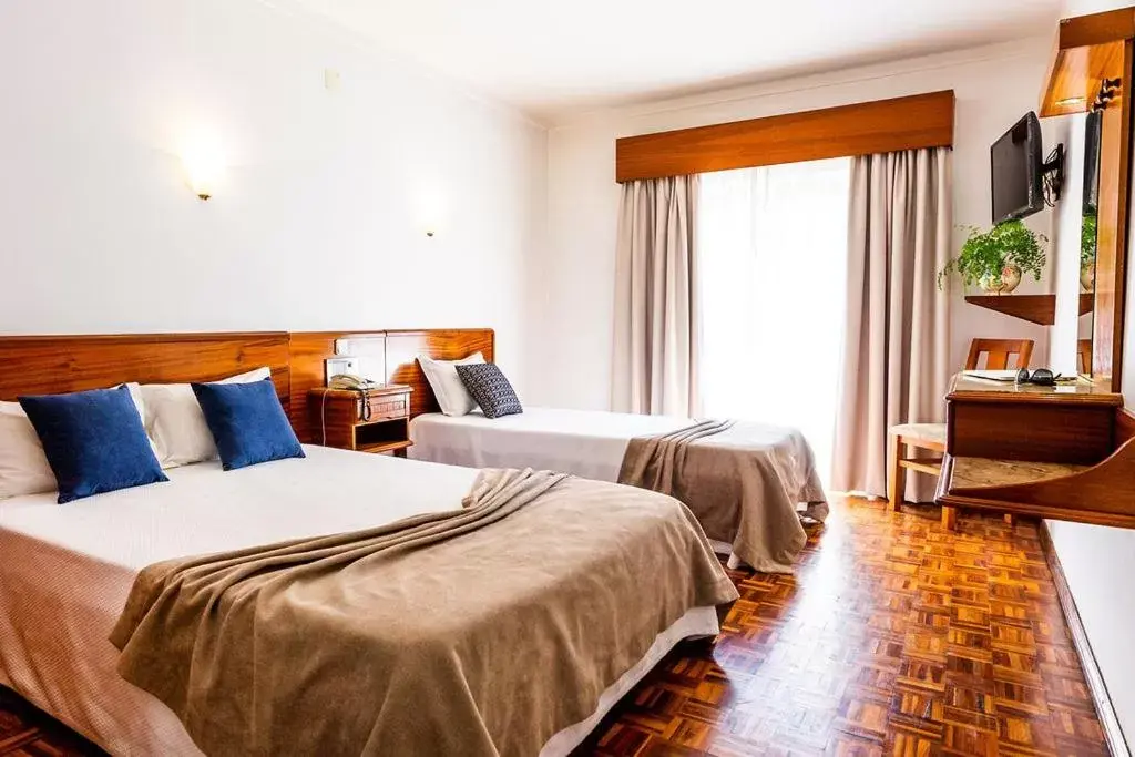 Bed in Dona Amélia Hotel by RIDAN Hotels