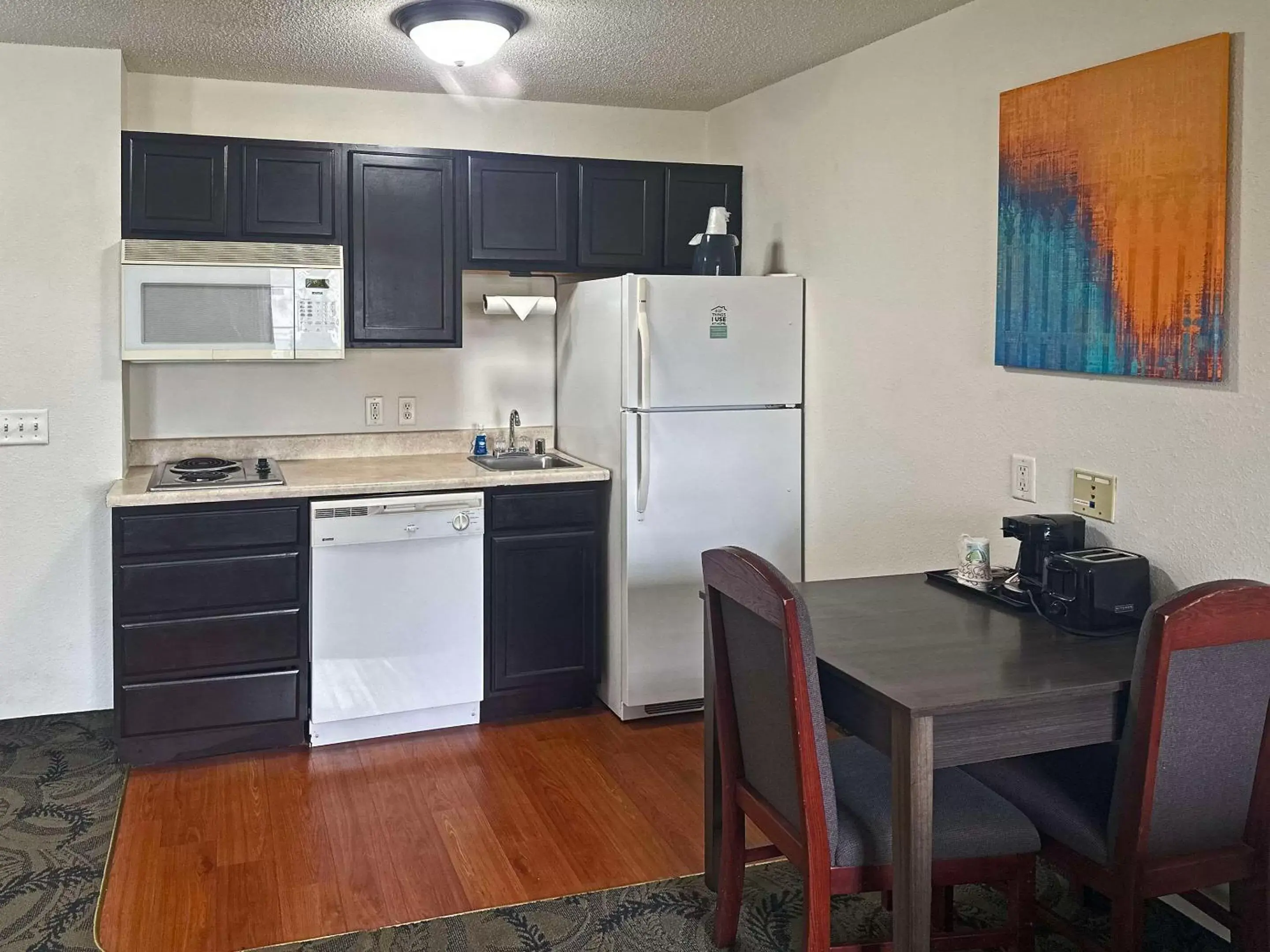 Bedroom, Kitchen/Kitchenette in MainStay Suites Madison East